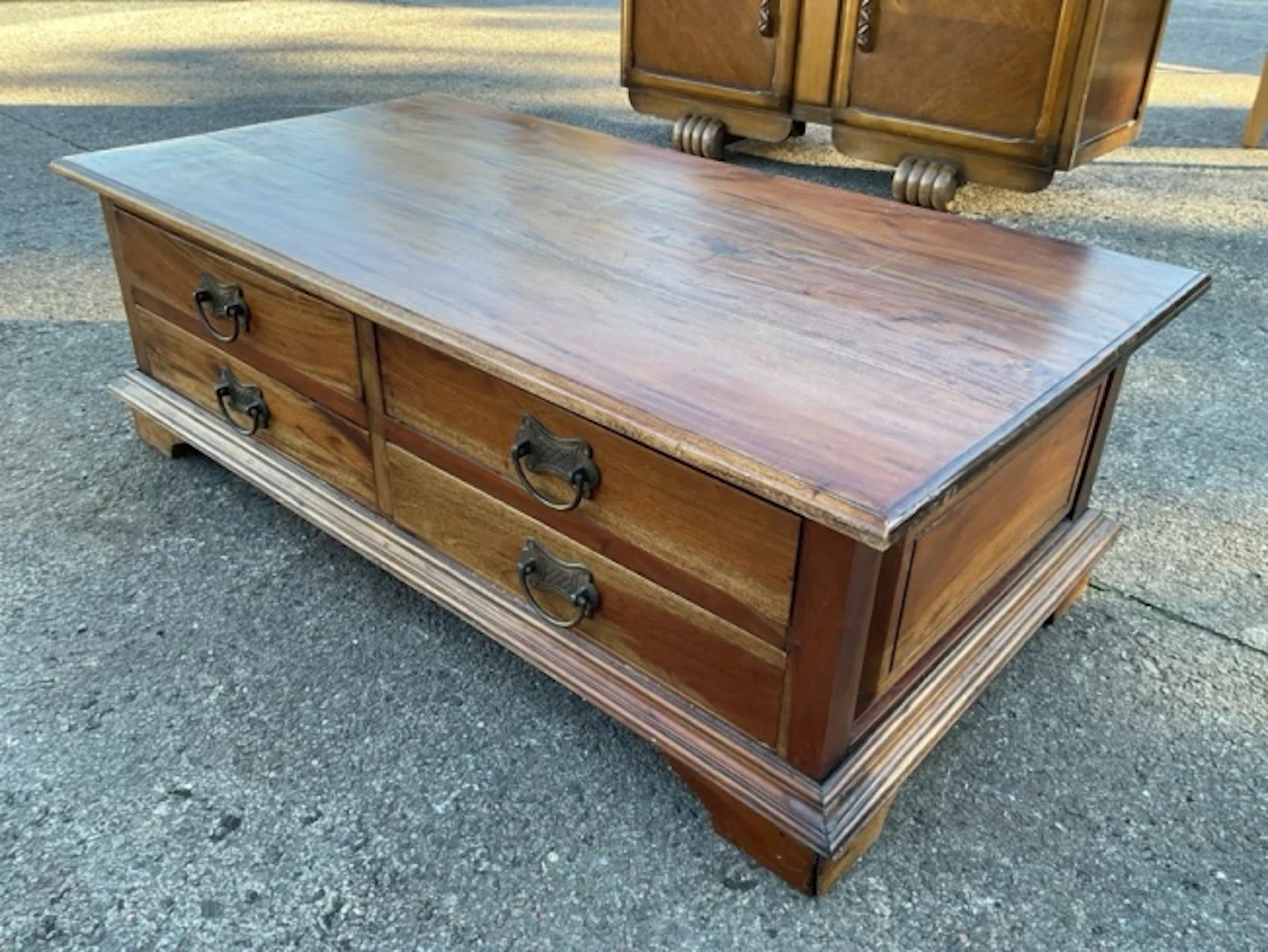 A contemporary hardwood coffee table with moulded rectangular top