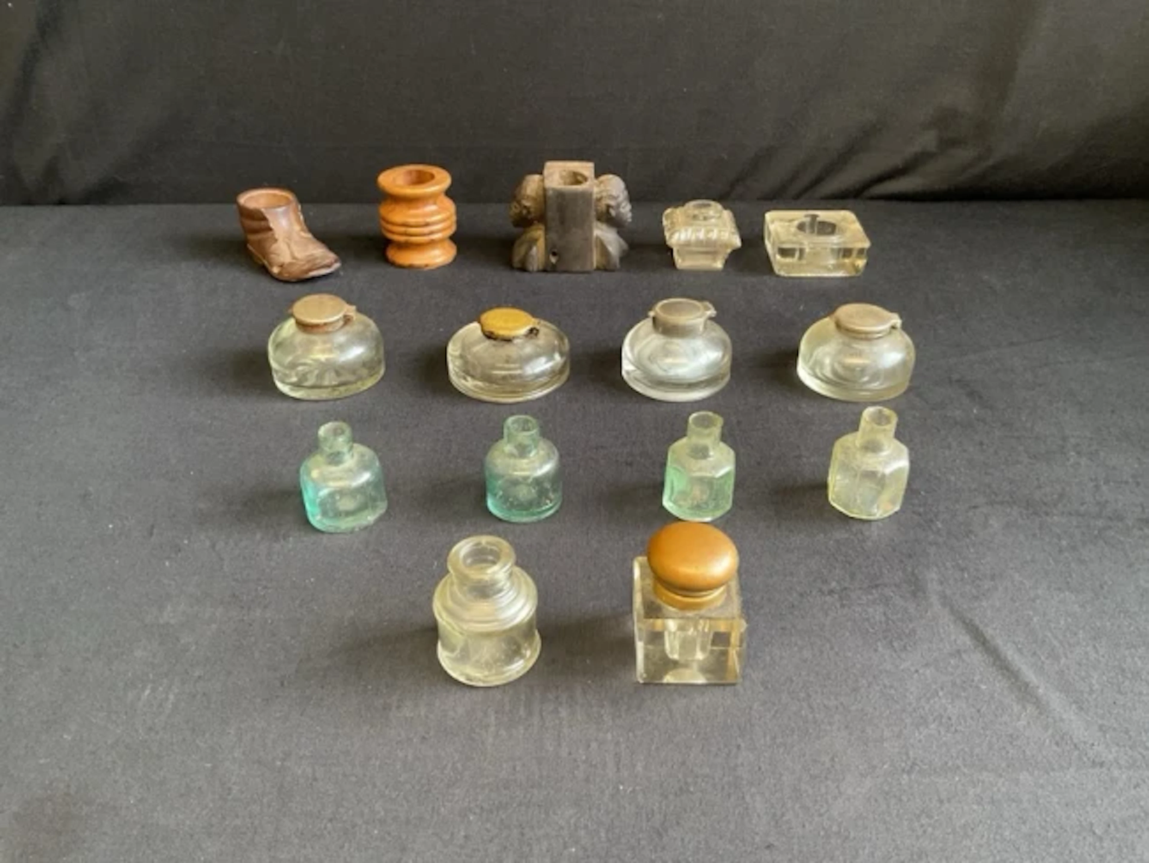 A collection of inkwells and ink bottles - a Black Forest lime wood
