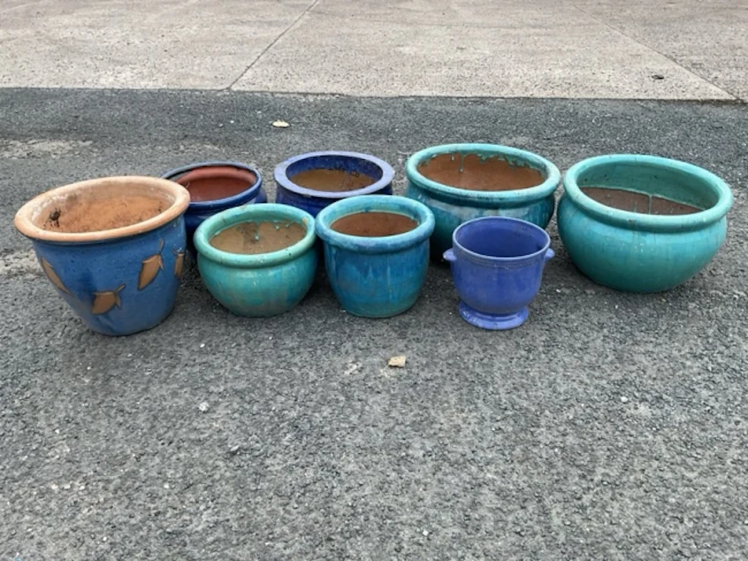 Eight miscellaneous glazed basin shaped stoneware & terracotta garden