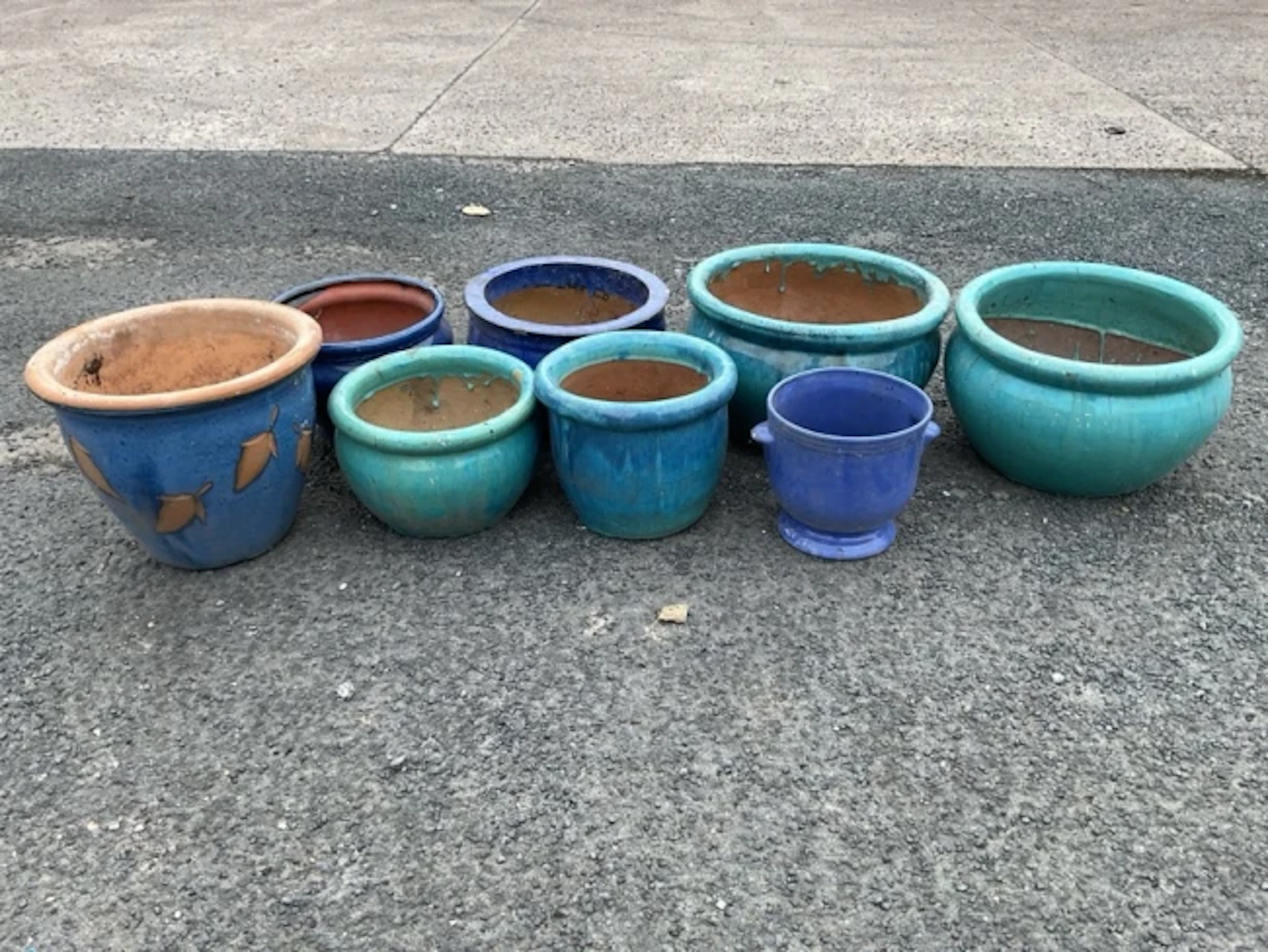 Eight miscellaneous glazed basin shaped stoneware & terracotta garden