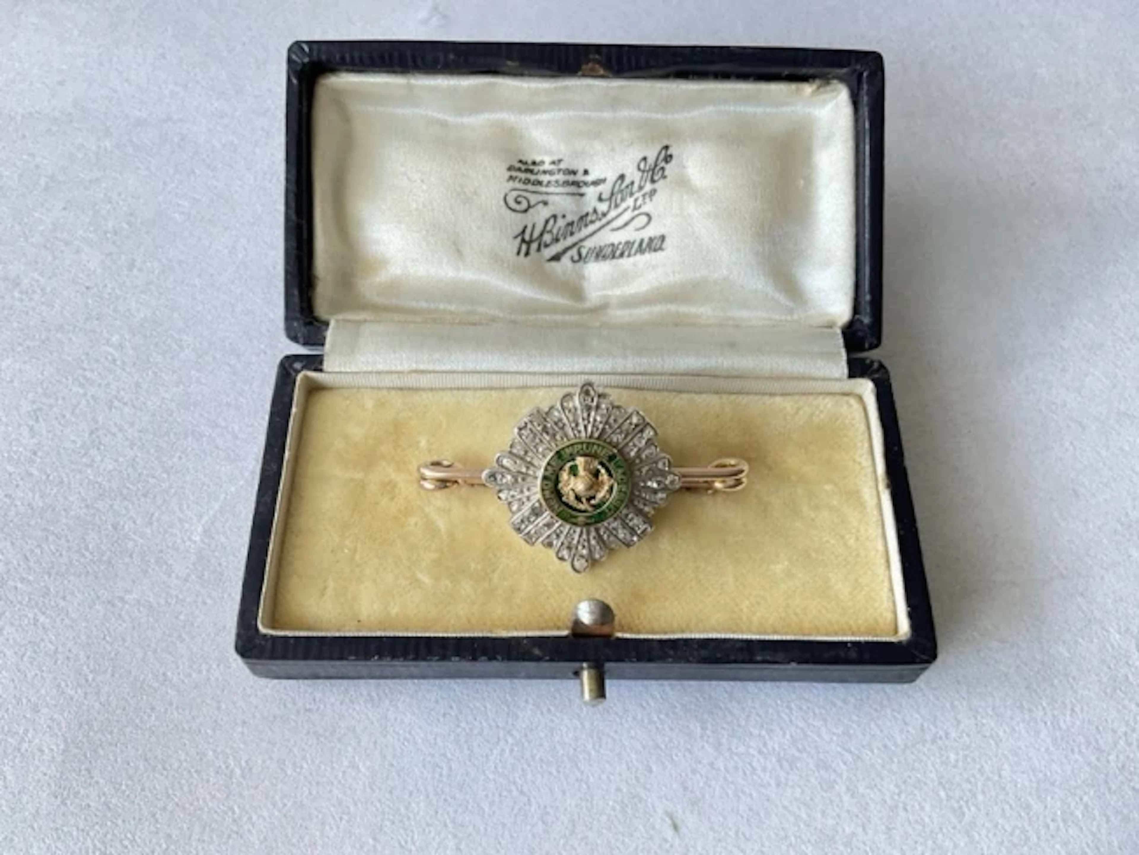 A boxed gold, diamond & enamel sweetheart brooch for the Scots Guards