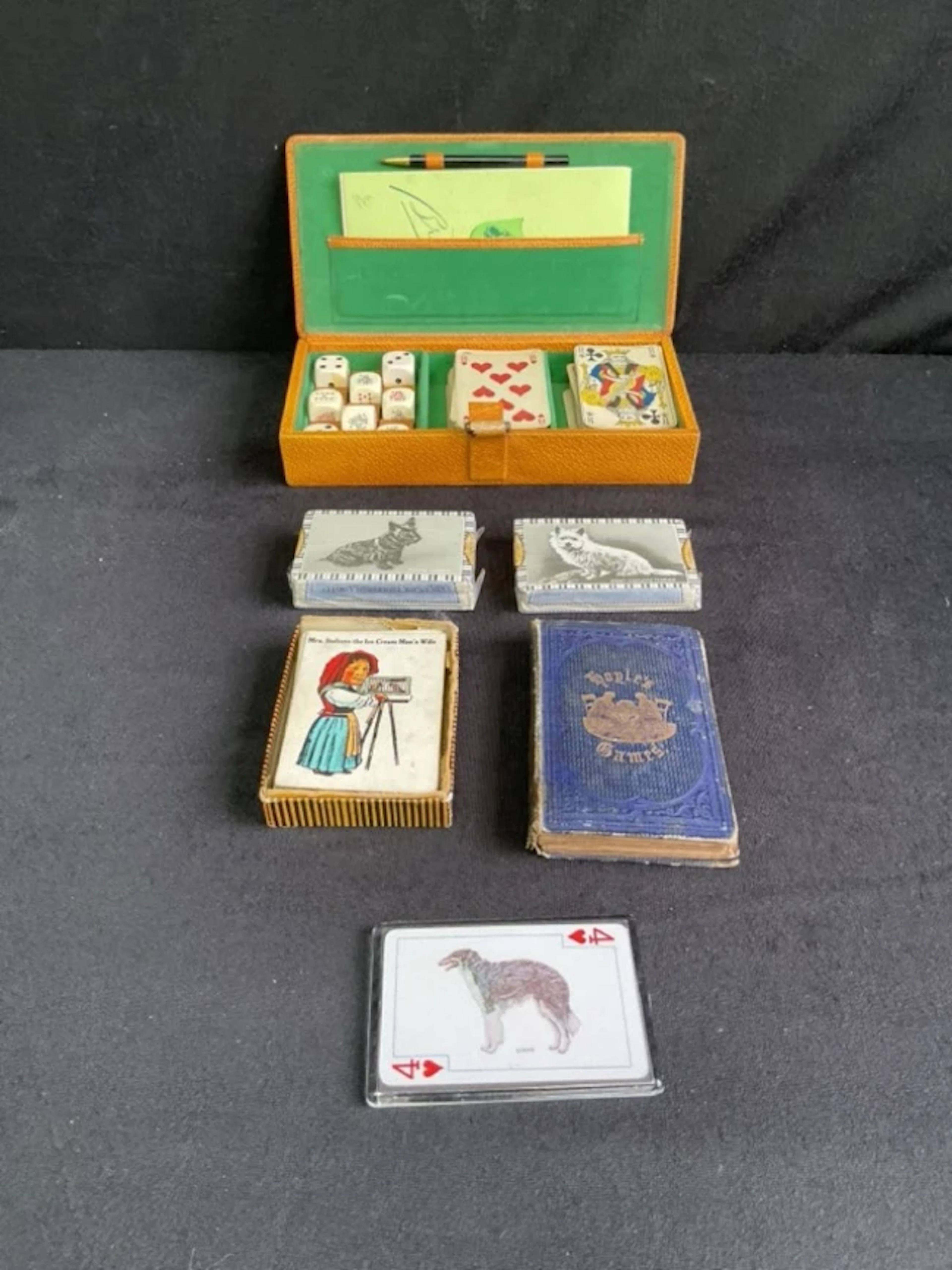 An 1862 edition of Hoyles Games; a boxed set of Bridge cards and poker