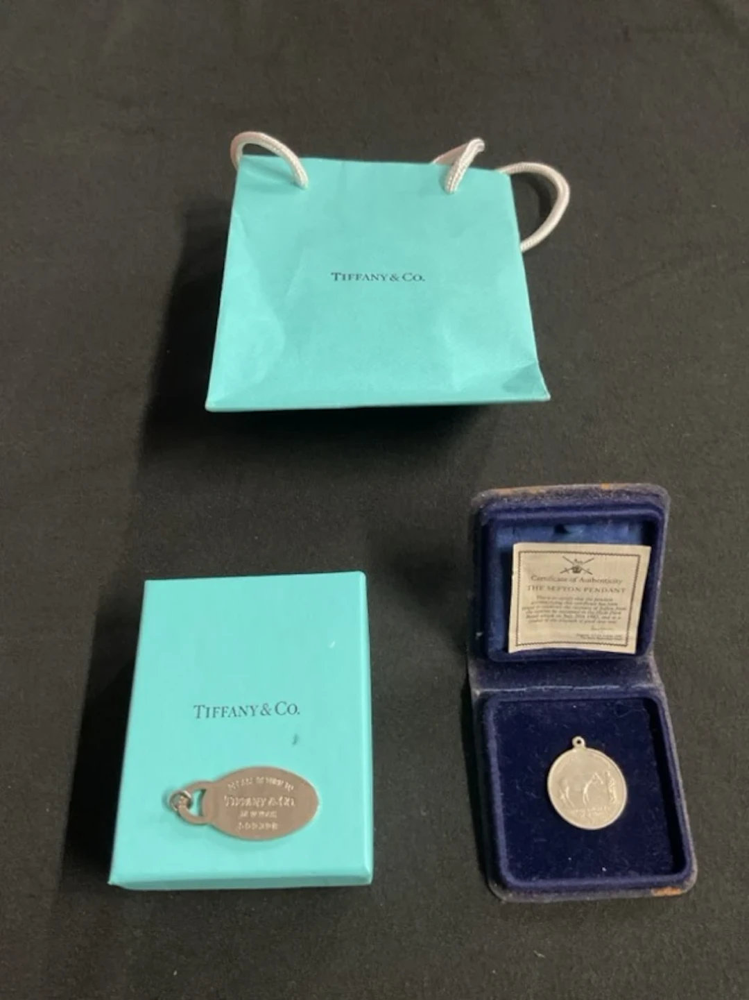 A boxed Tiffany & Co 925 silver oval tag pendant with original carrier