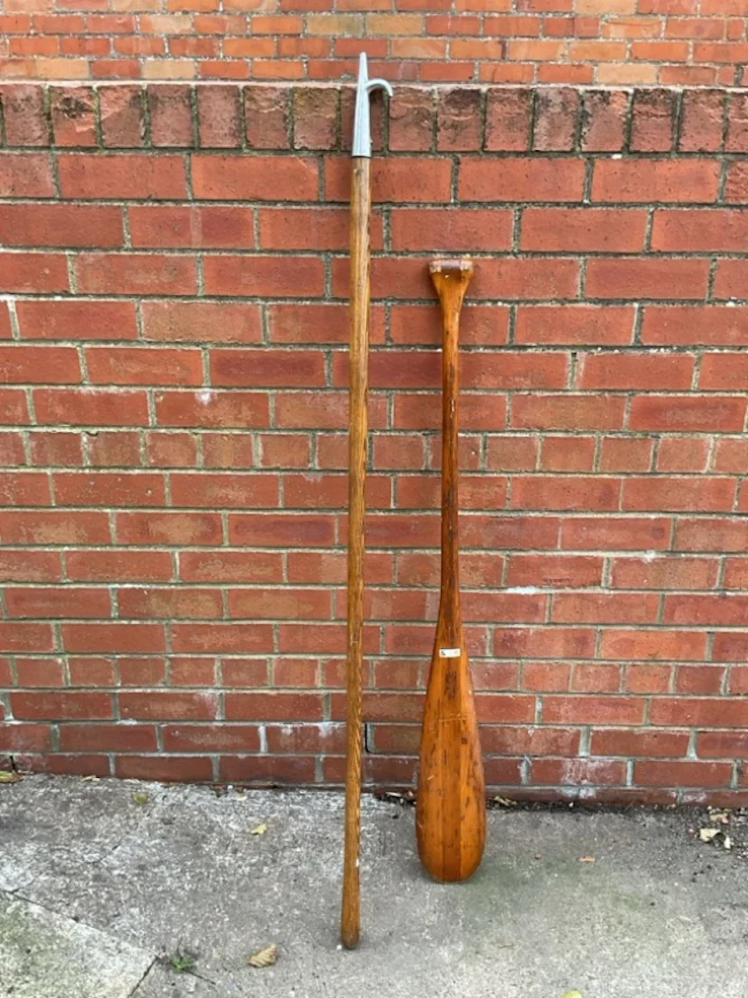 A 5ft oak boat hook with polished steel head; and a 4ft pine beavertail