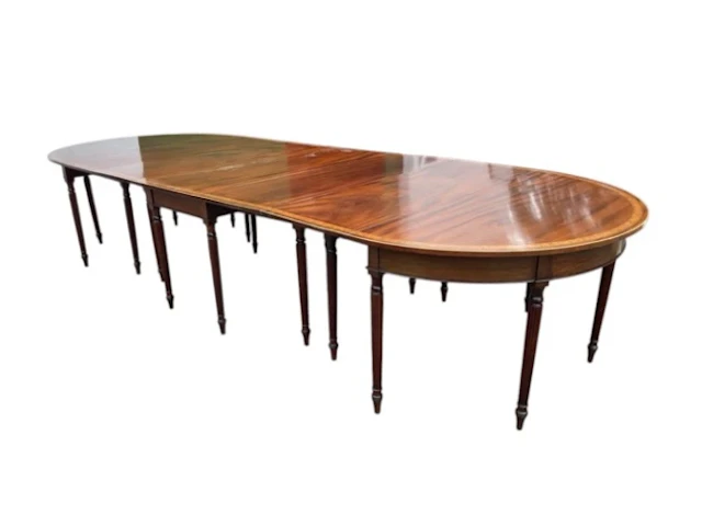 A Georgian mahogany dining table with some alterations - supplied
