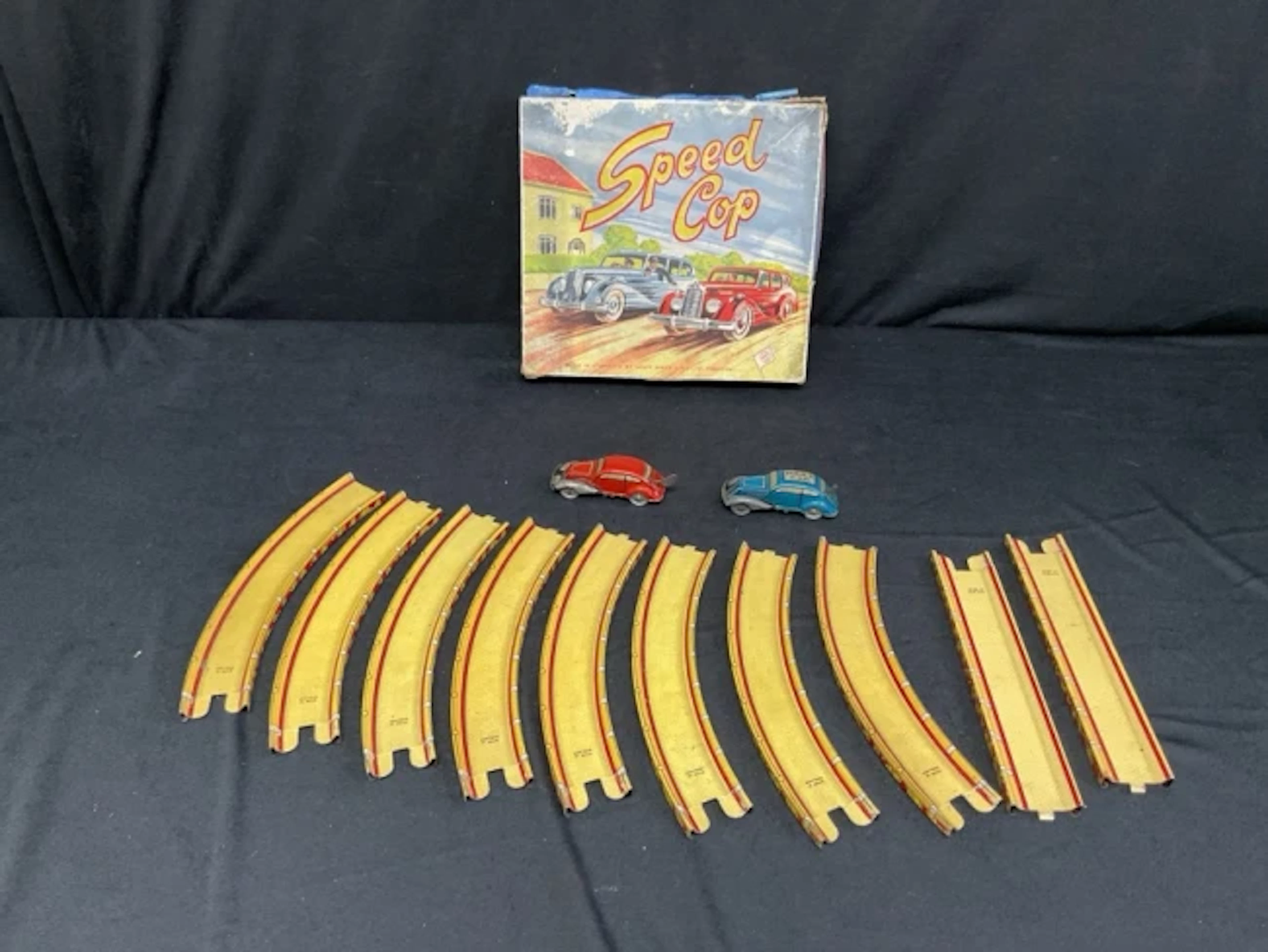 A 50s boxed clockwork tinplate Speed Cop car chase set with police