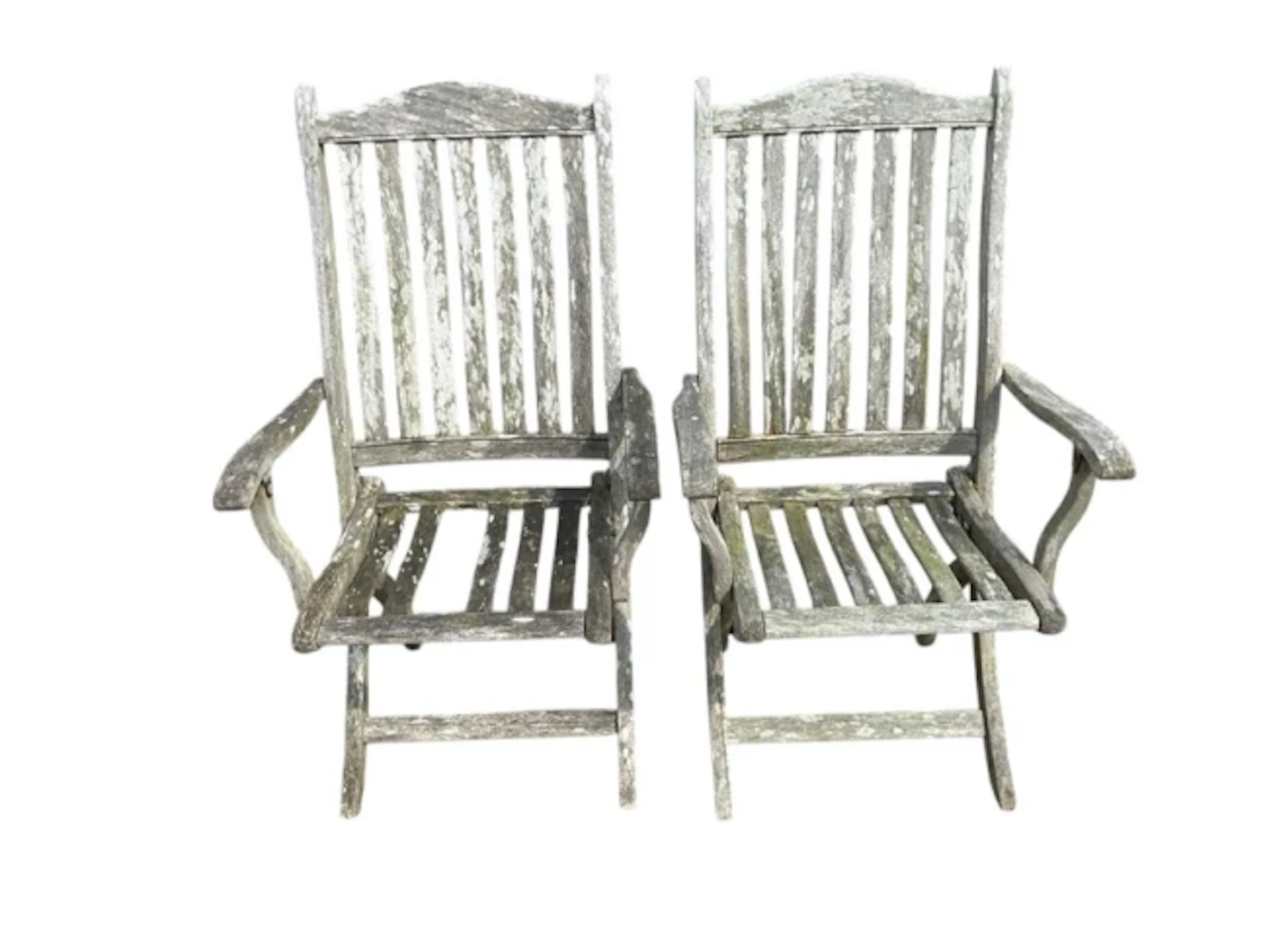 A pair of teak folding garden armchairs with slatted backs & seats
