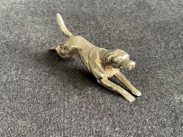 A hallmarked solid silver model of a sprinting foxhound - London 1890.
