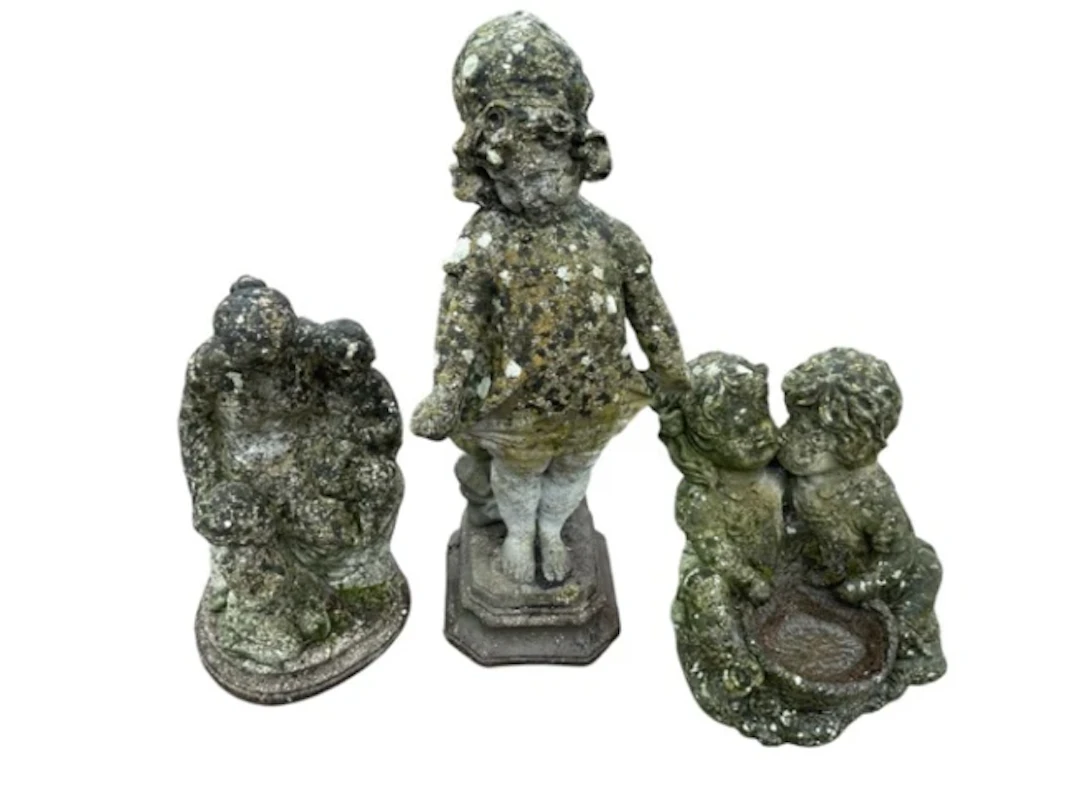 Three composition stone garden figural sculptures - a girl in frock