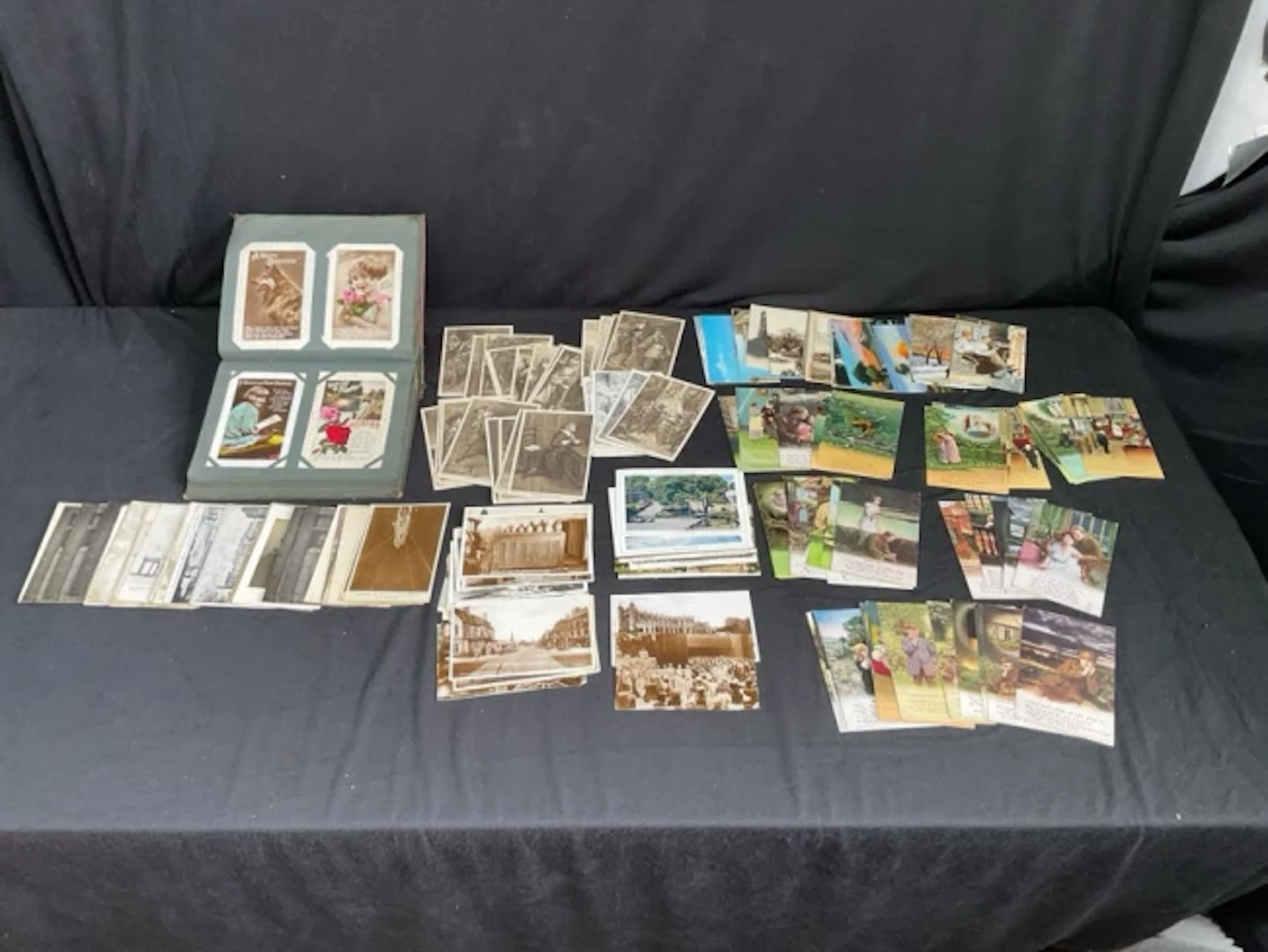 A 20s postcard album containing 74 birthday, sentimental and animal