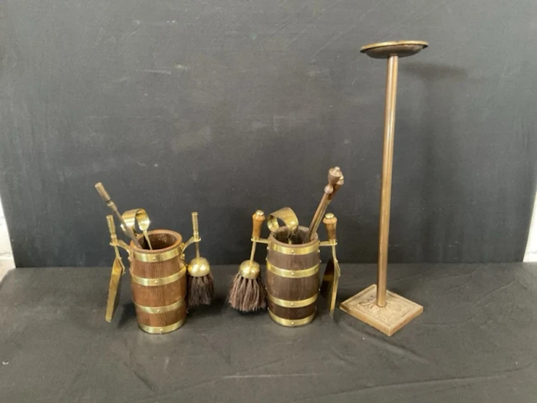Two similar fire tool sets with pokers, tongs, shovels & brushes in