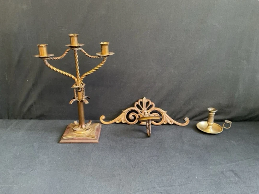 A Victorian gothic brass three-light candelabra, a regency style cast