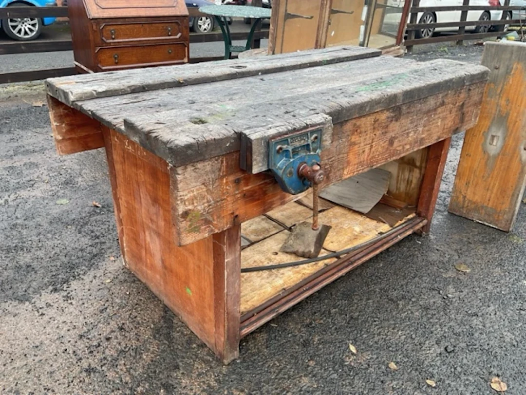 A workbench having channelled rectangular top fitted with two Record