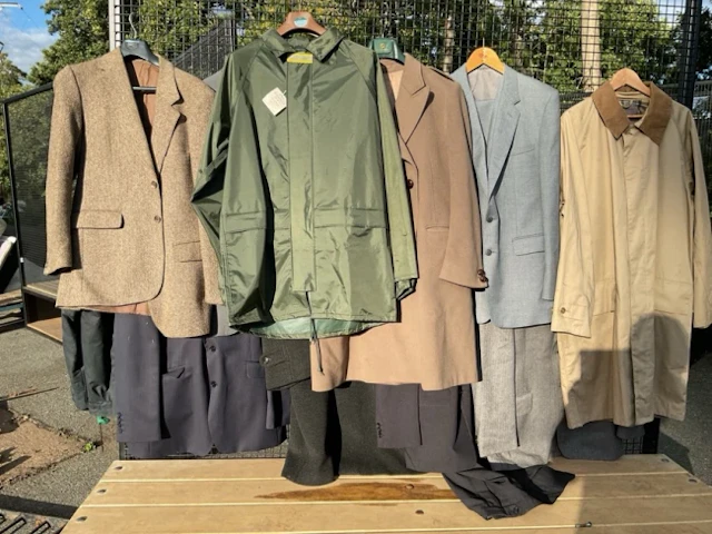 A quantity of gentlemans clothing - coats, suits, jackets, Barbour