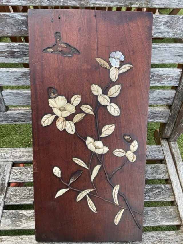 A C19th Japanese hardwood Shibayama panel inlaid with mother-of-pearl