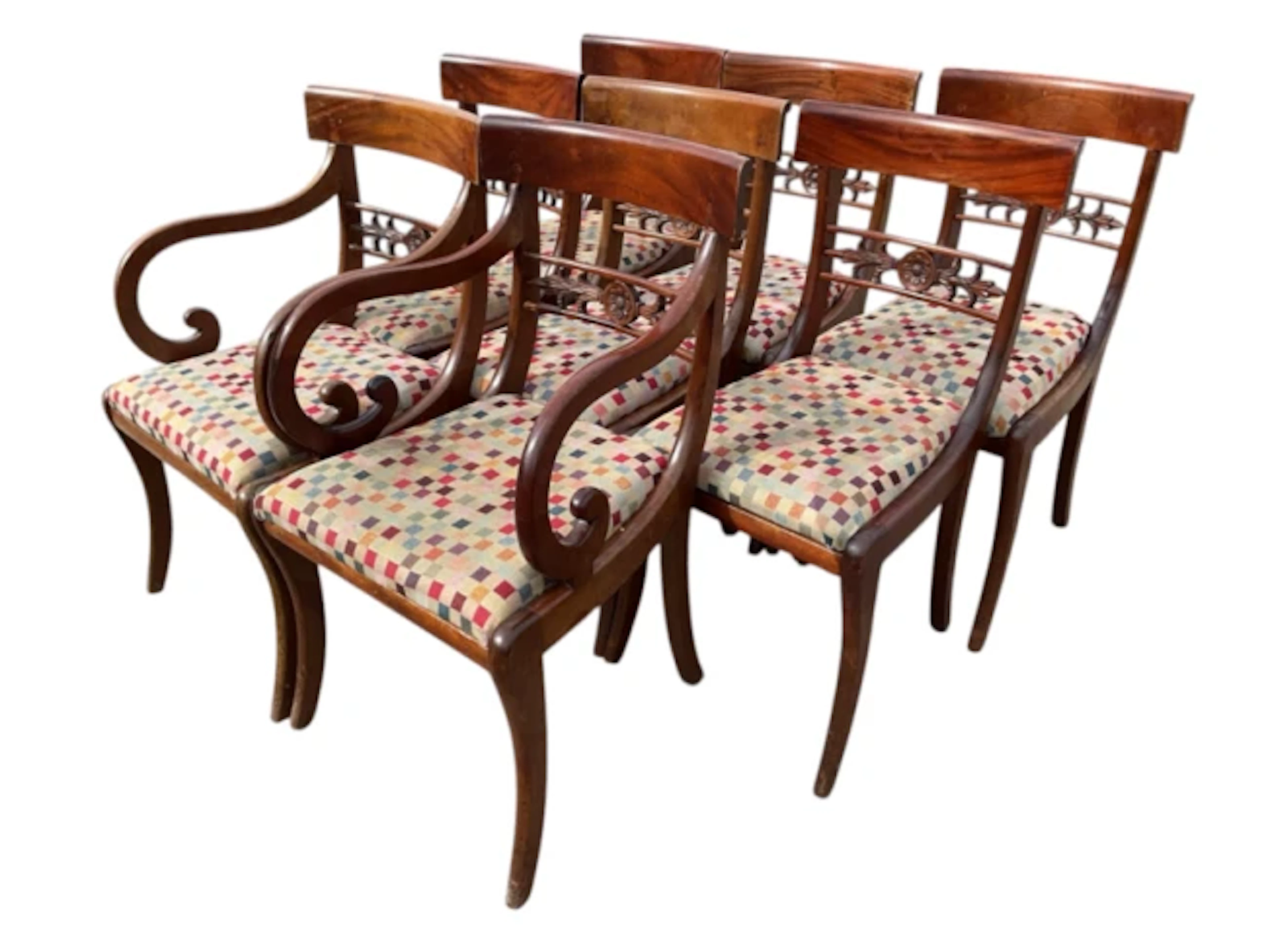 A set of eight regency mahogany dining chairs with curved backs above