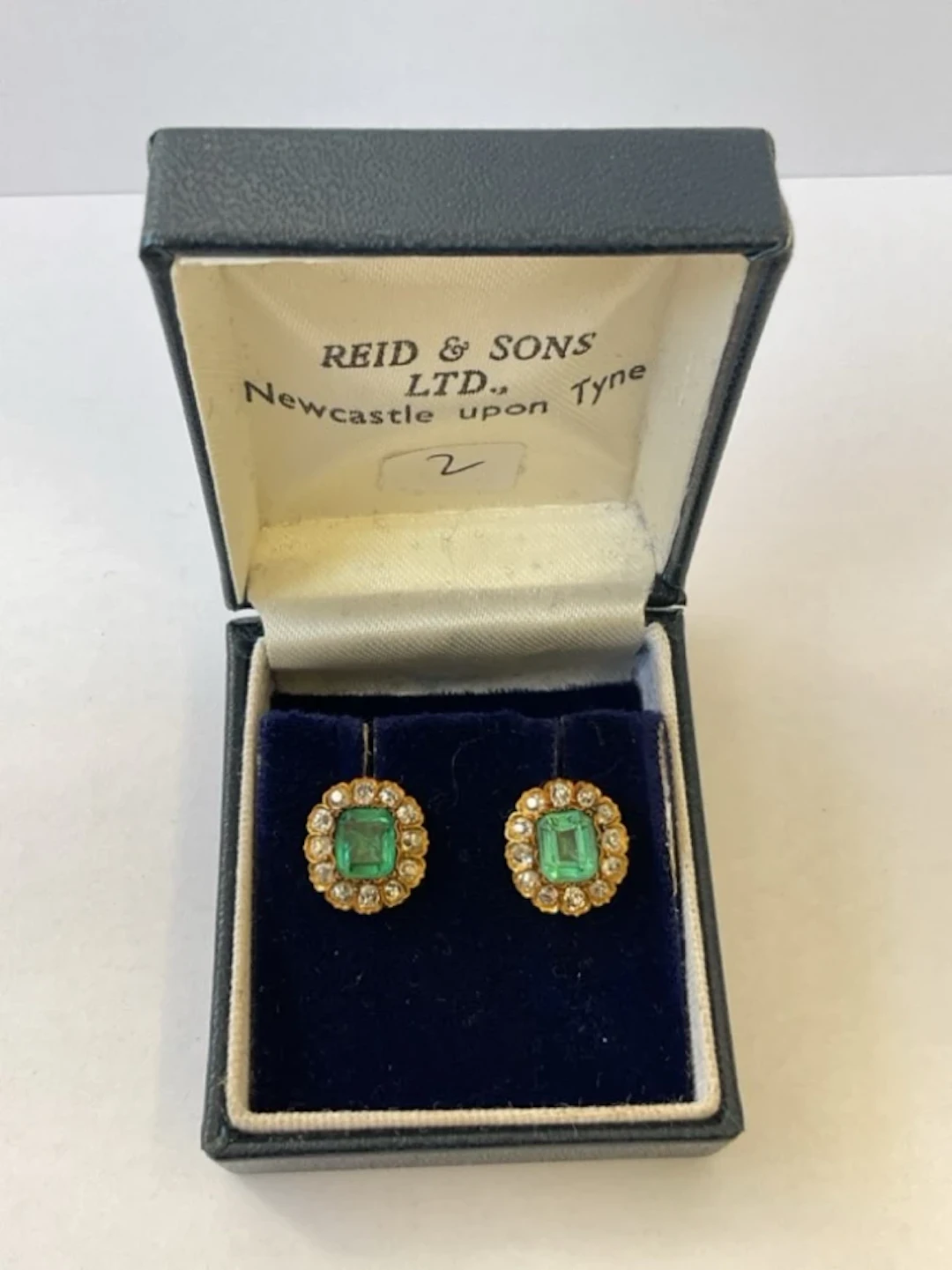 A pair of antique gold emerald & diamond earrings, the central emerald