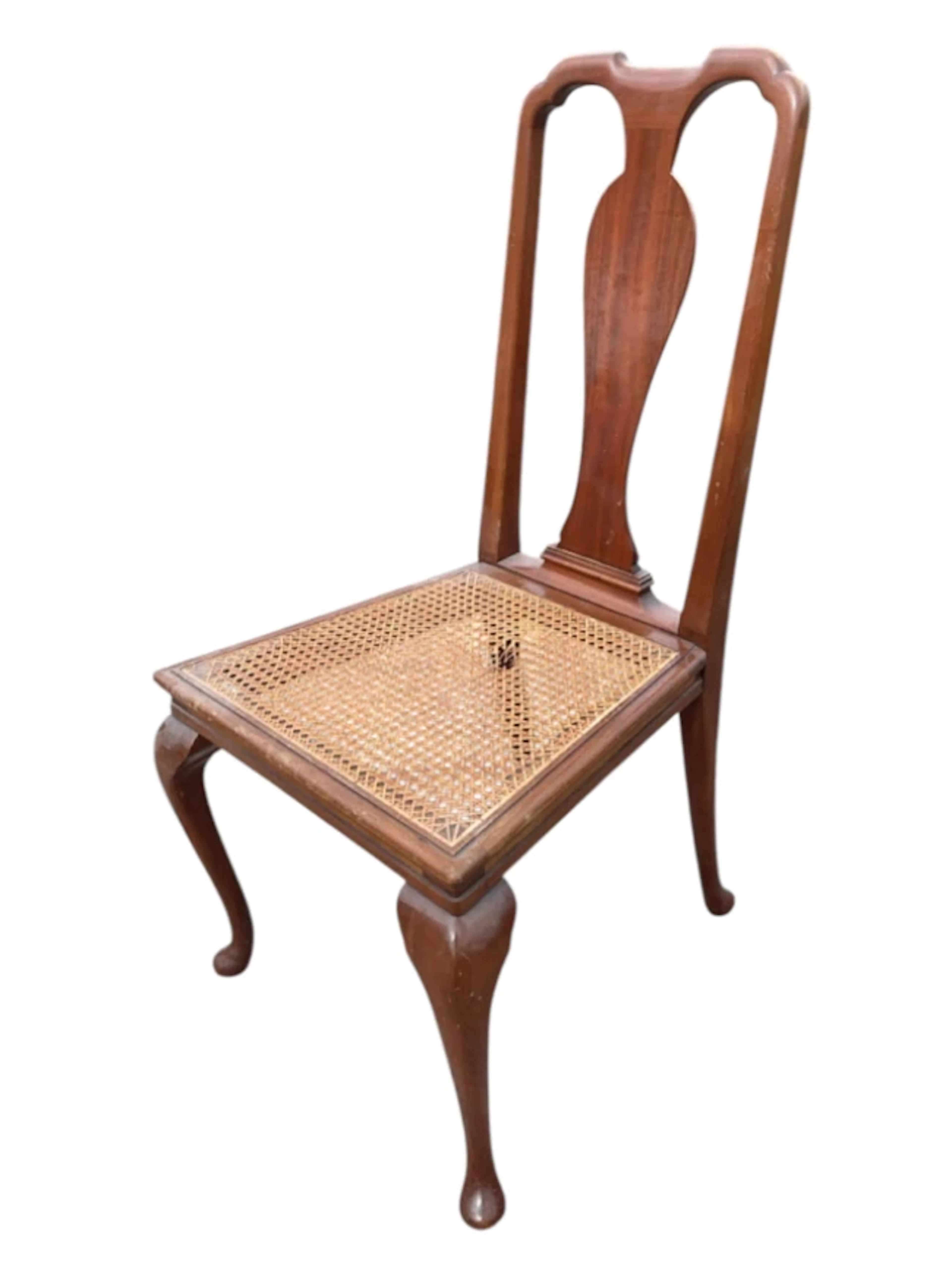 A Queen Anne style mahogany chair with vase shaped splat above a cane