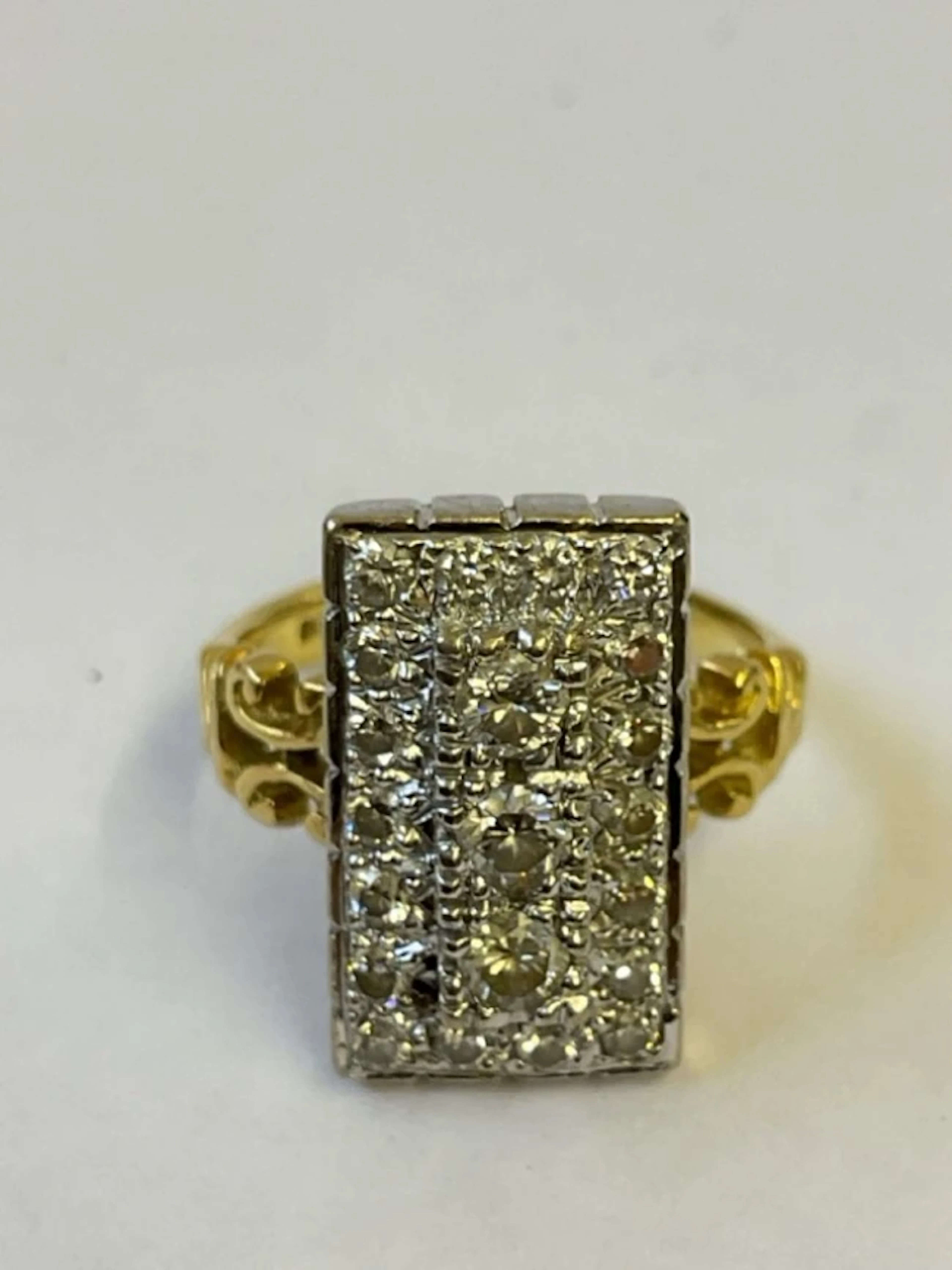 An 18ct gold diamond plaque ring, the rectangular mount set with 21