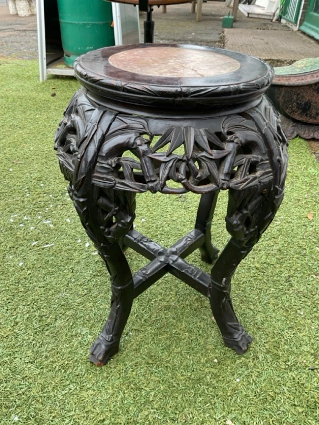 A nineteenth century carved Japanese jardinière stand with circular