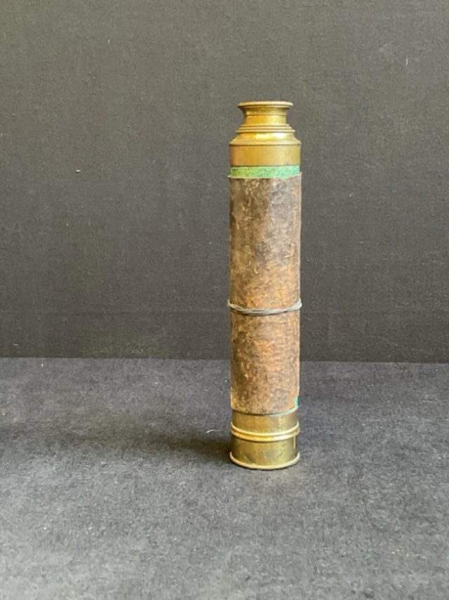 A Victorian four-draw leather bound brass telescope with brass lens