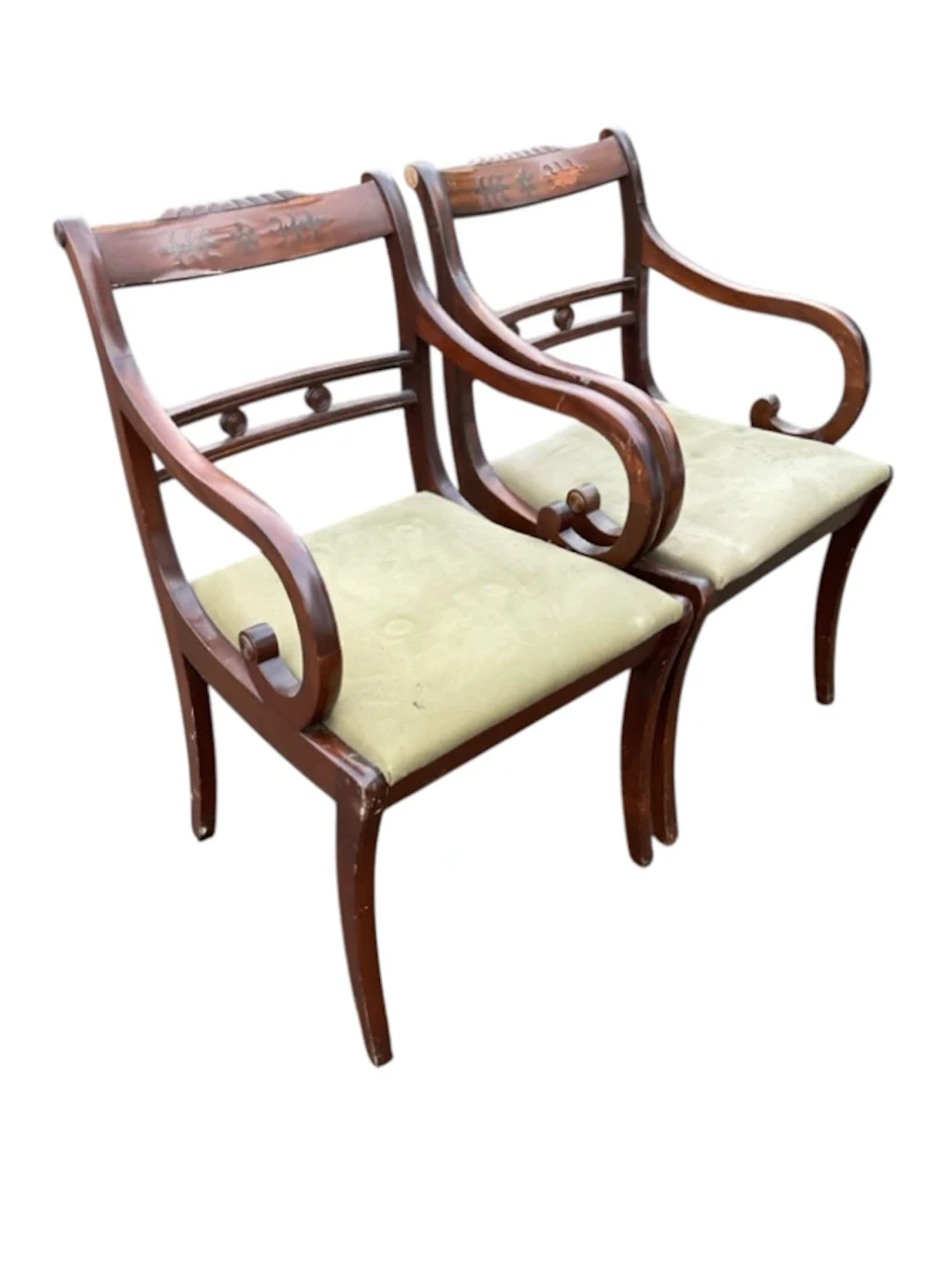 A pair of regency style mahogany elbow chairs with gadroon carved