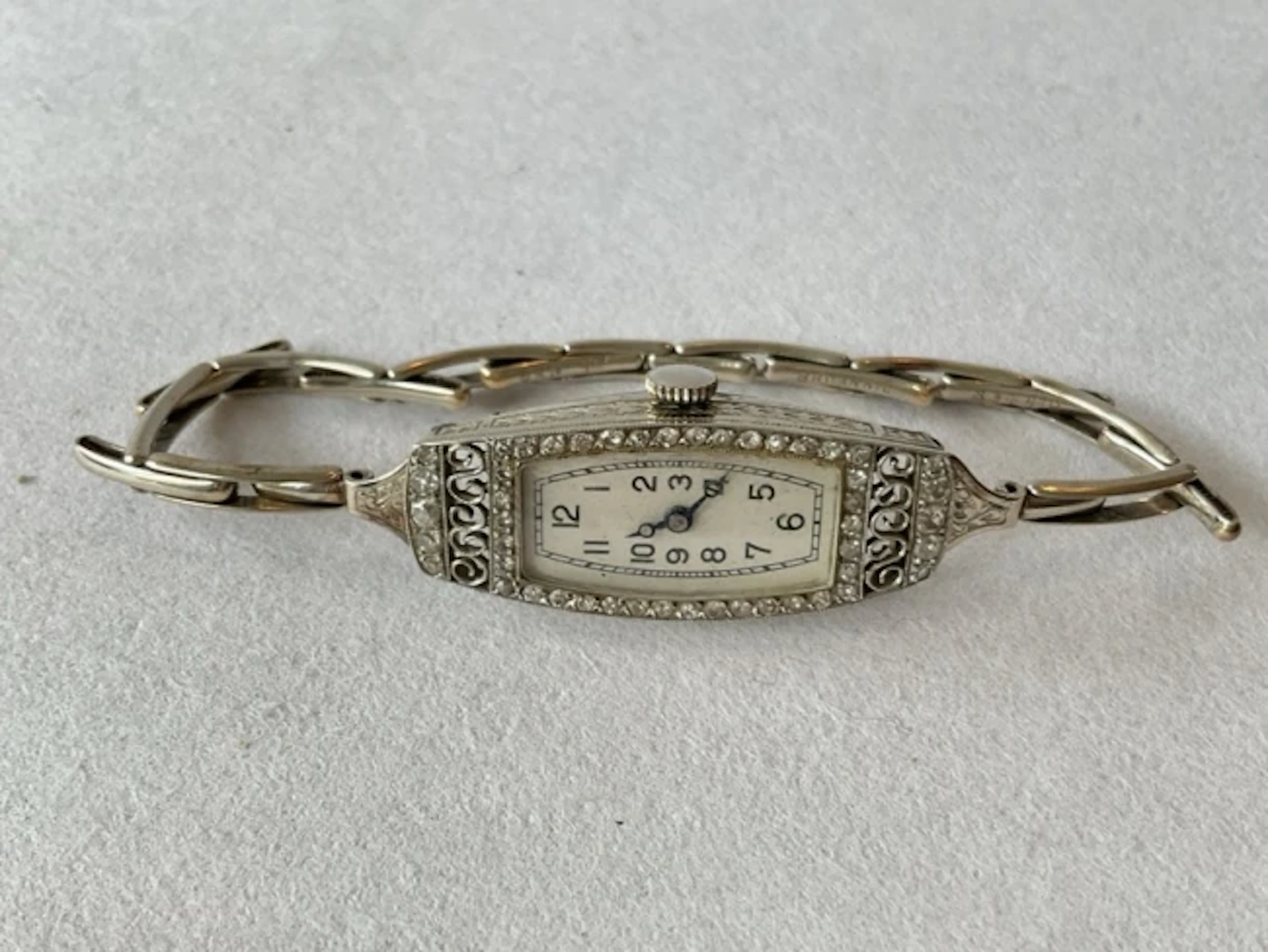 An antique 18ct white gold cocktail watch, the rectangular dial with