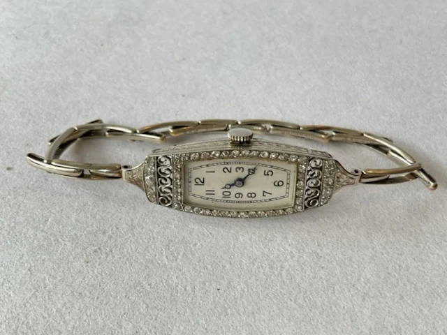 An antique belle epoque 18ct white gold cocktail watch, the rectangular
