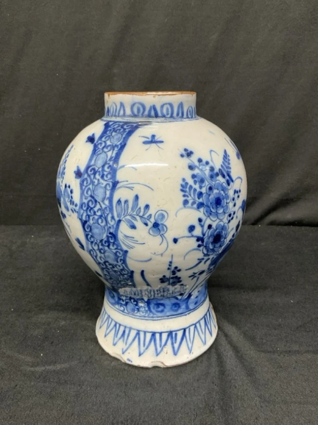 An C18th Dutch delft inverted baluster vase decorated in underglaze