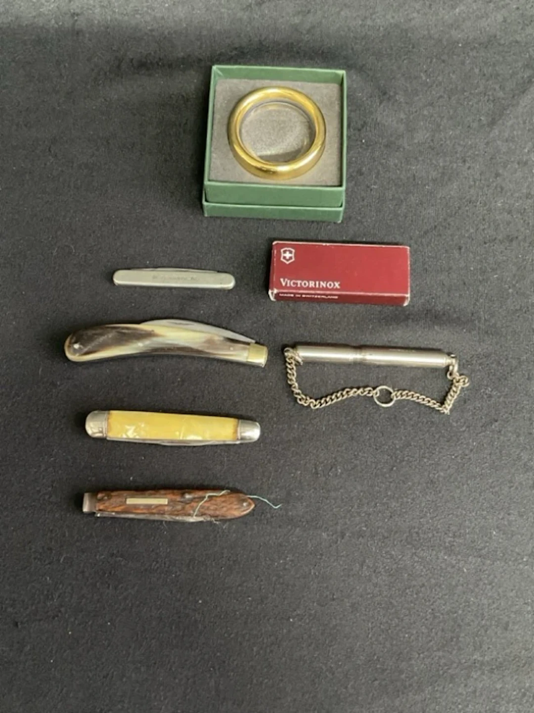 A boxed Victorinox miniature penknife; a horn handled folding knife