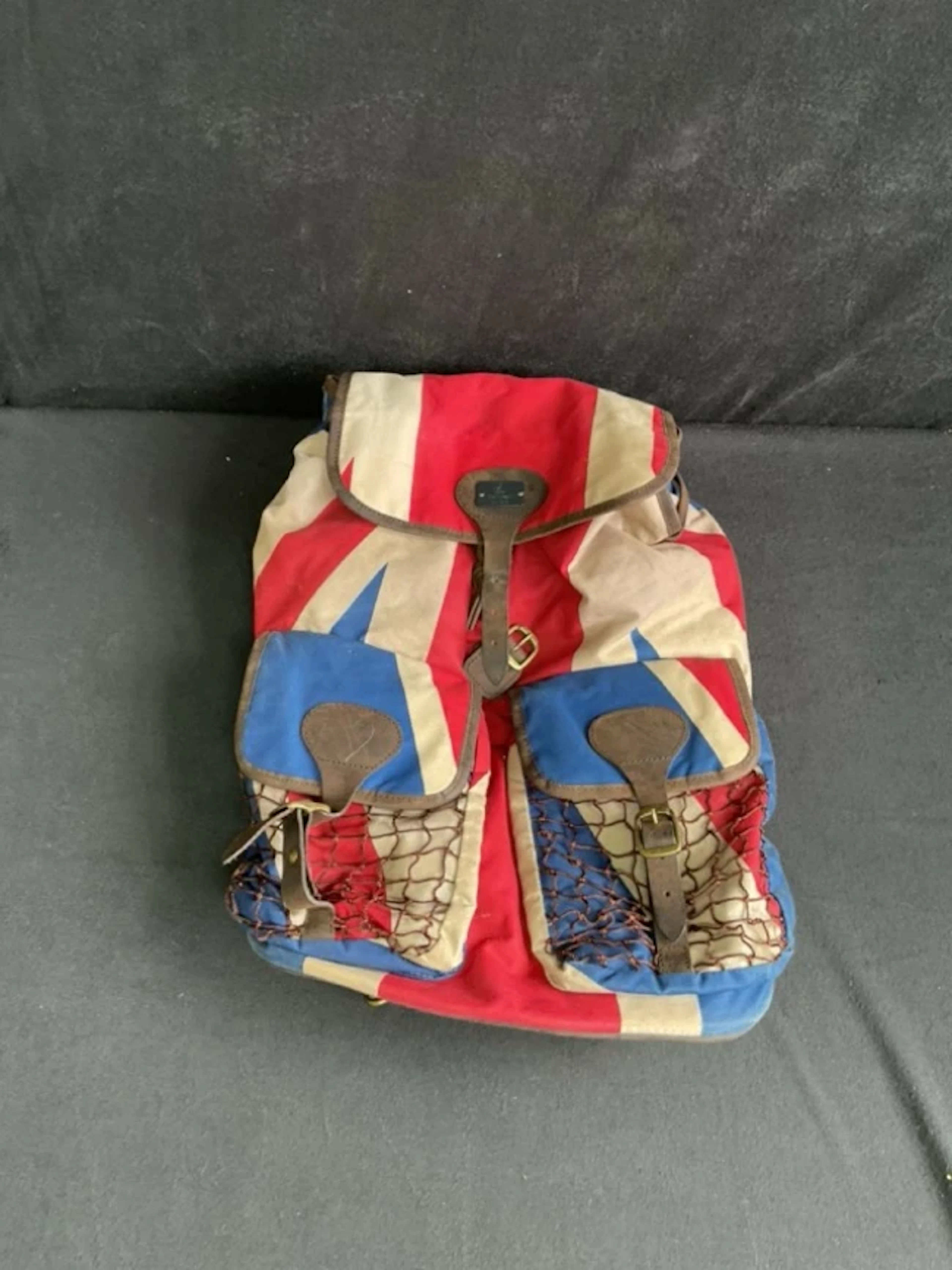 A Barbour waxed cotton Union Flag rucksack with draw-string opening