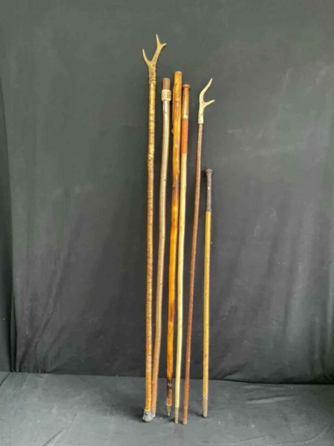 Two hazel thumbsticks with antler handles, a Scottish stick with antler