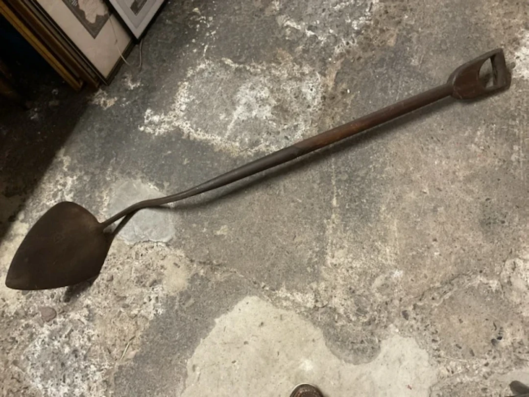 A Victorian wrought iron sweetheart peat shovel with heart shaped