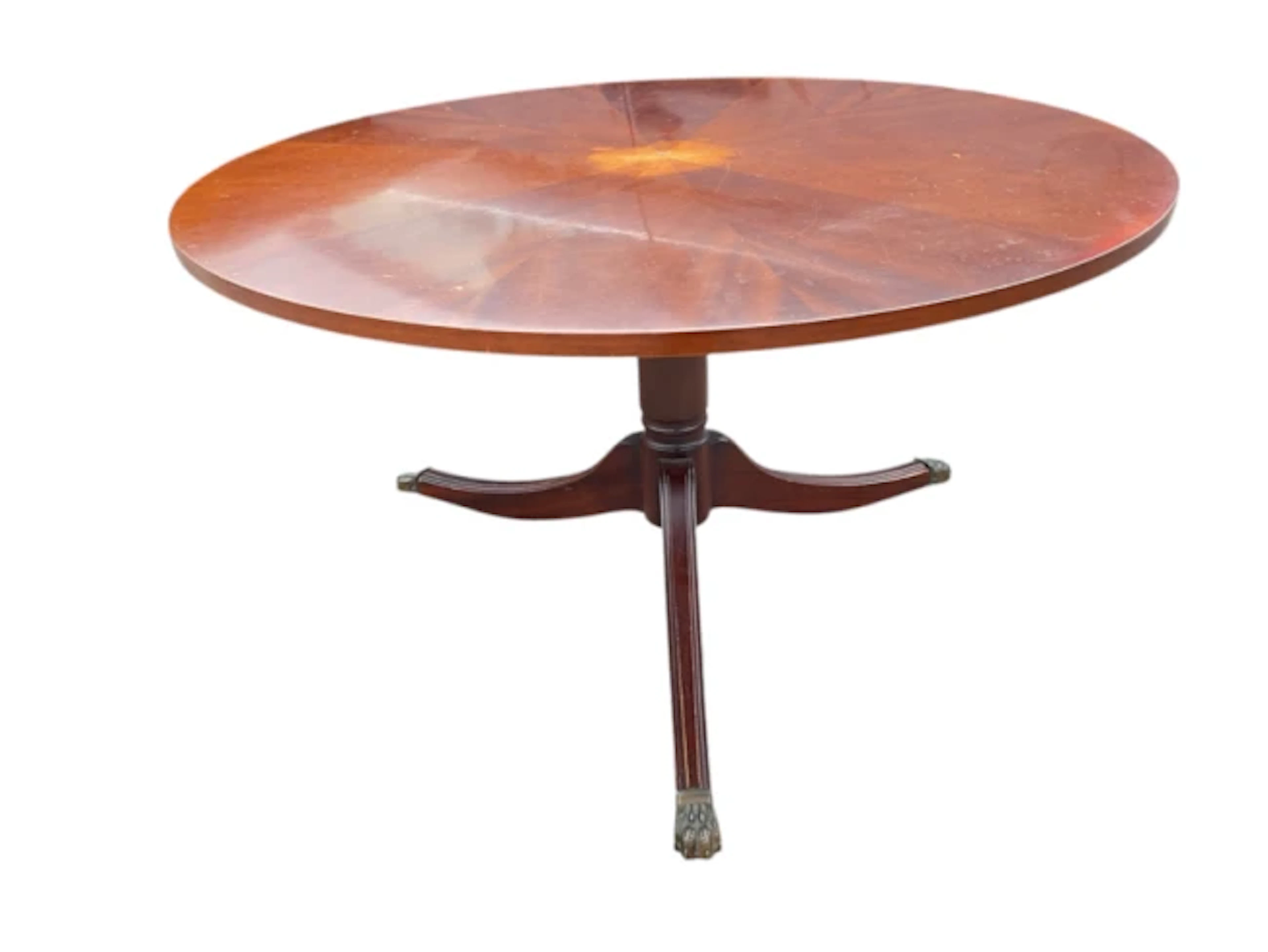 A regency style mahogany coffee table with circular segmentally veneered