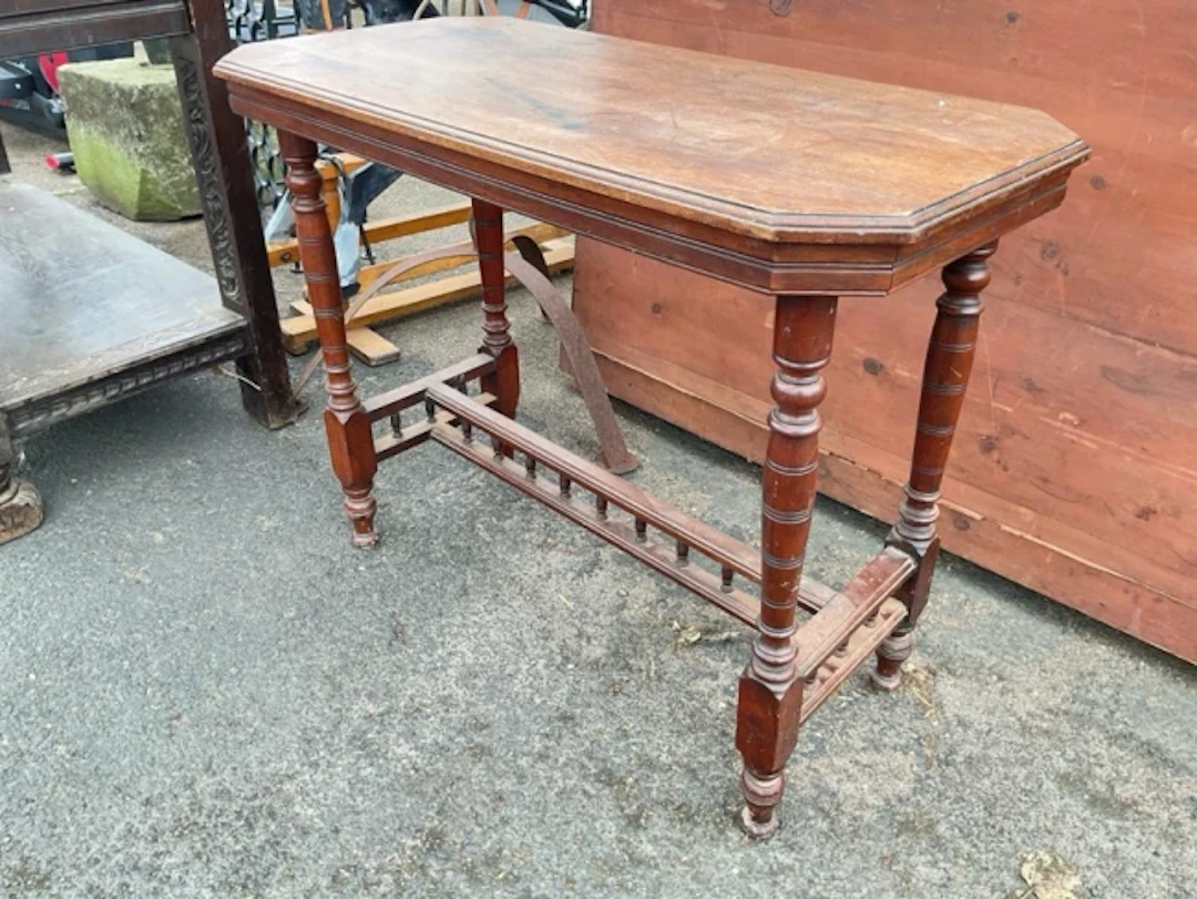A Victorian walnut occasional table with rectangular canted moulded