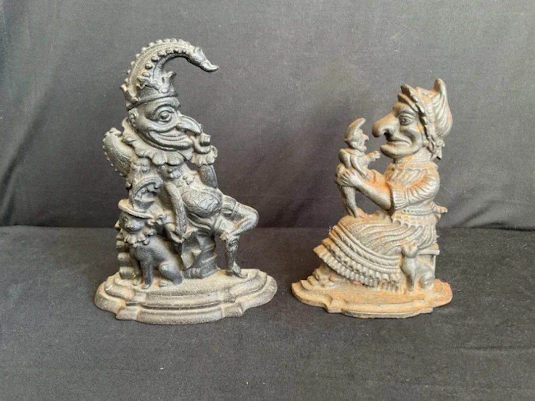 A pair of Victorian cast iron doorstops in the form of a seated Mr
