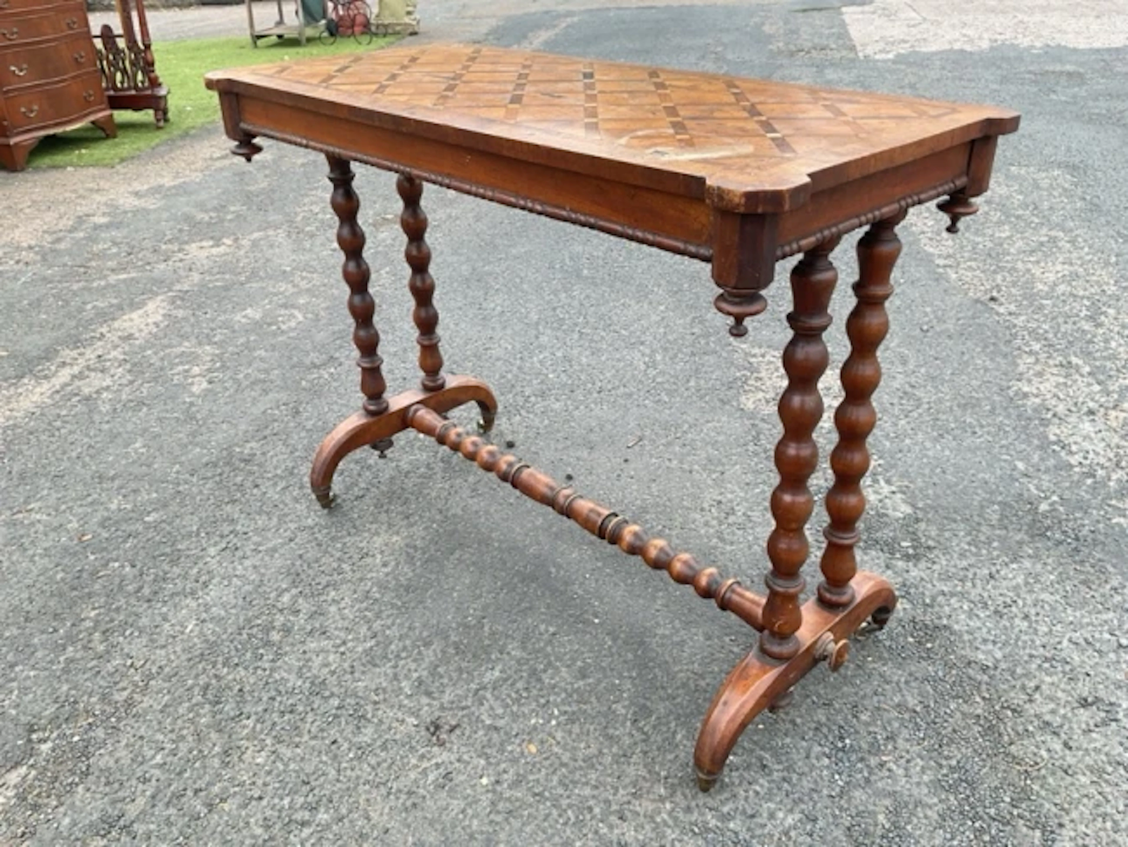A rectangular Victorian walnut centre table with geometric parquetry
