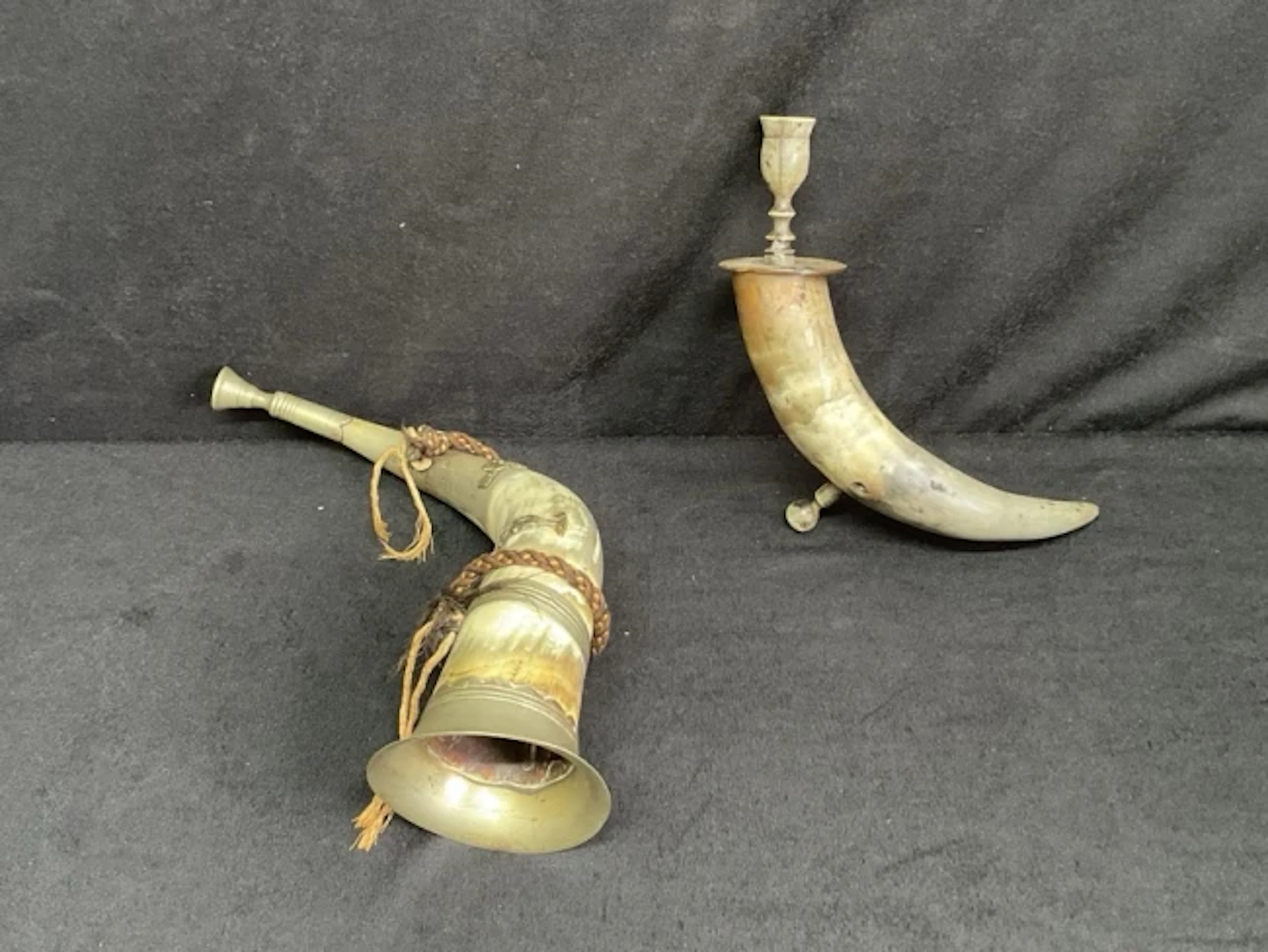 A cow horn stag hunting horn with nickel mouthpiece, flared throat