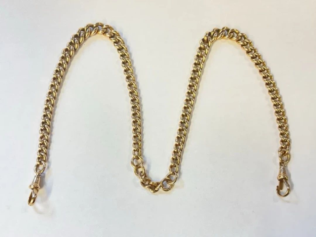 A 9ct gold double albert watch chain with graduated links by Charles