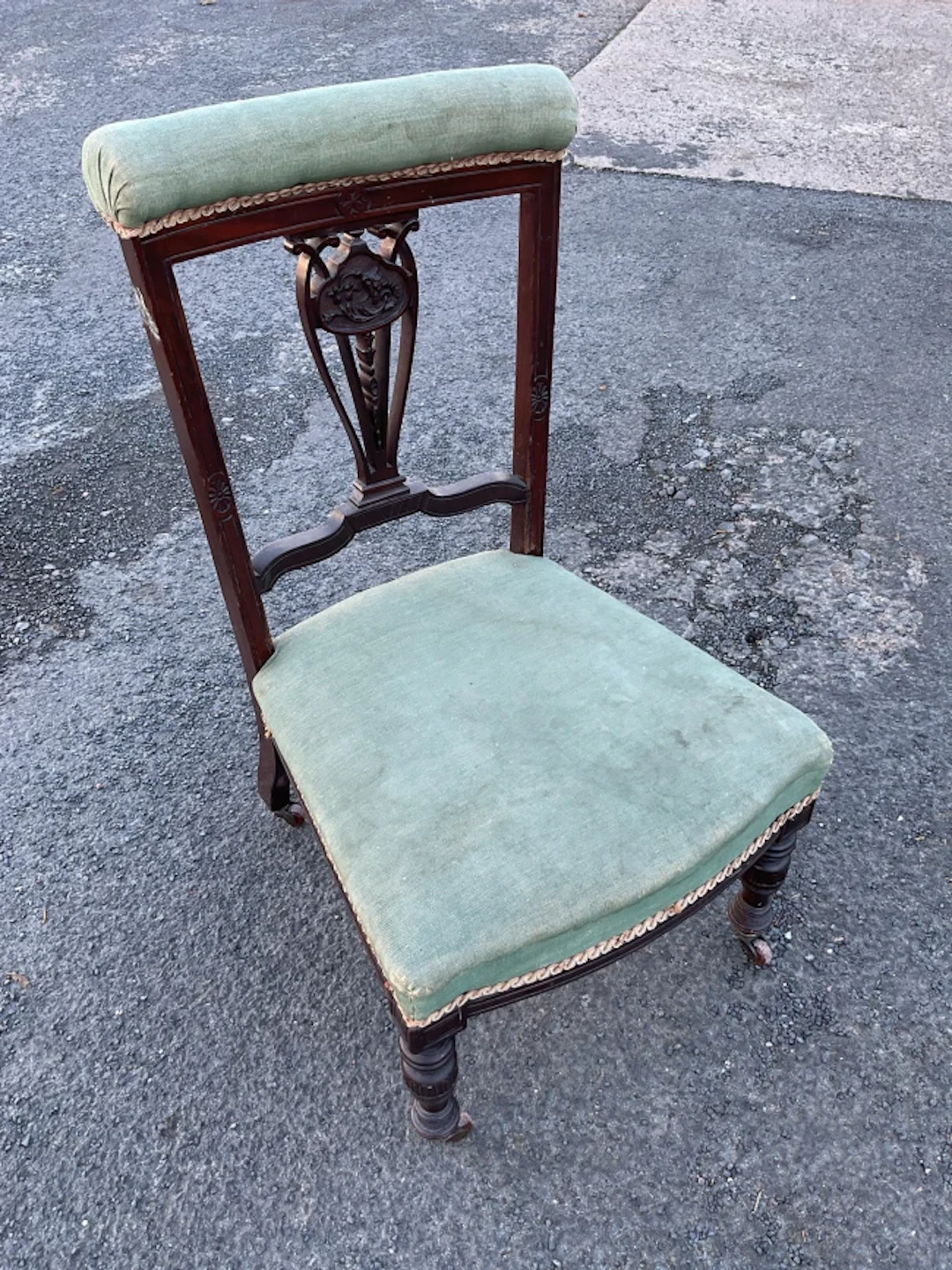A late Victorian mahogany priedieu chair with upholstered back rail