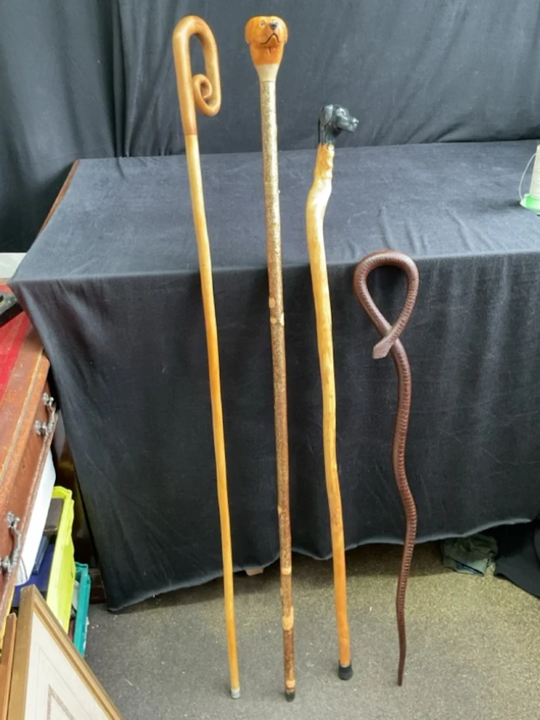 A Brigg natural wood walking stick with carved black Labrador head