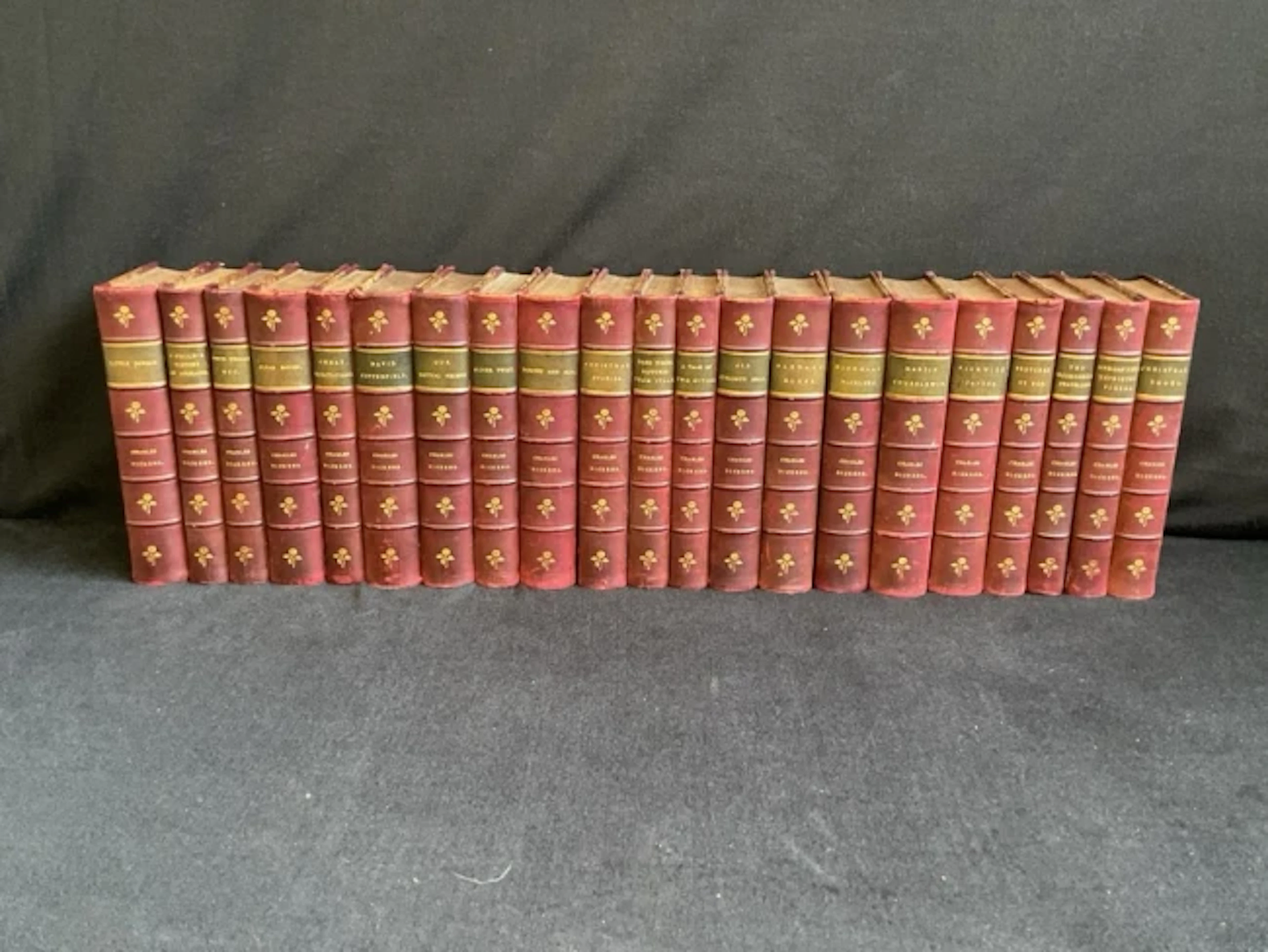 Twenty-one volumes of Dickens including novels, quarter leatherbound