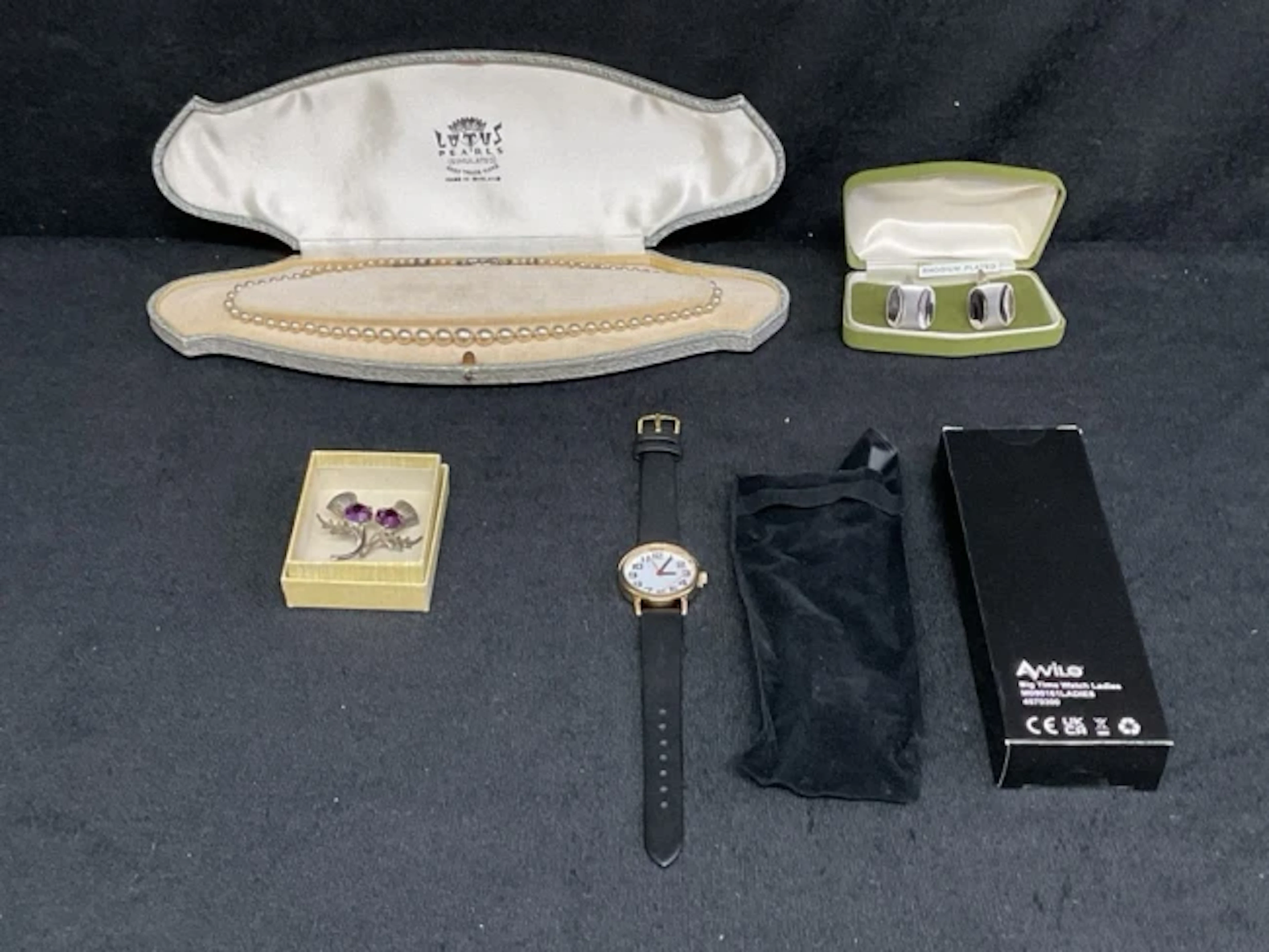 A boxed Lotus simulated pearl necklace with silver clasp; boxed 60s