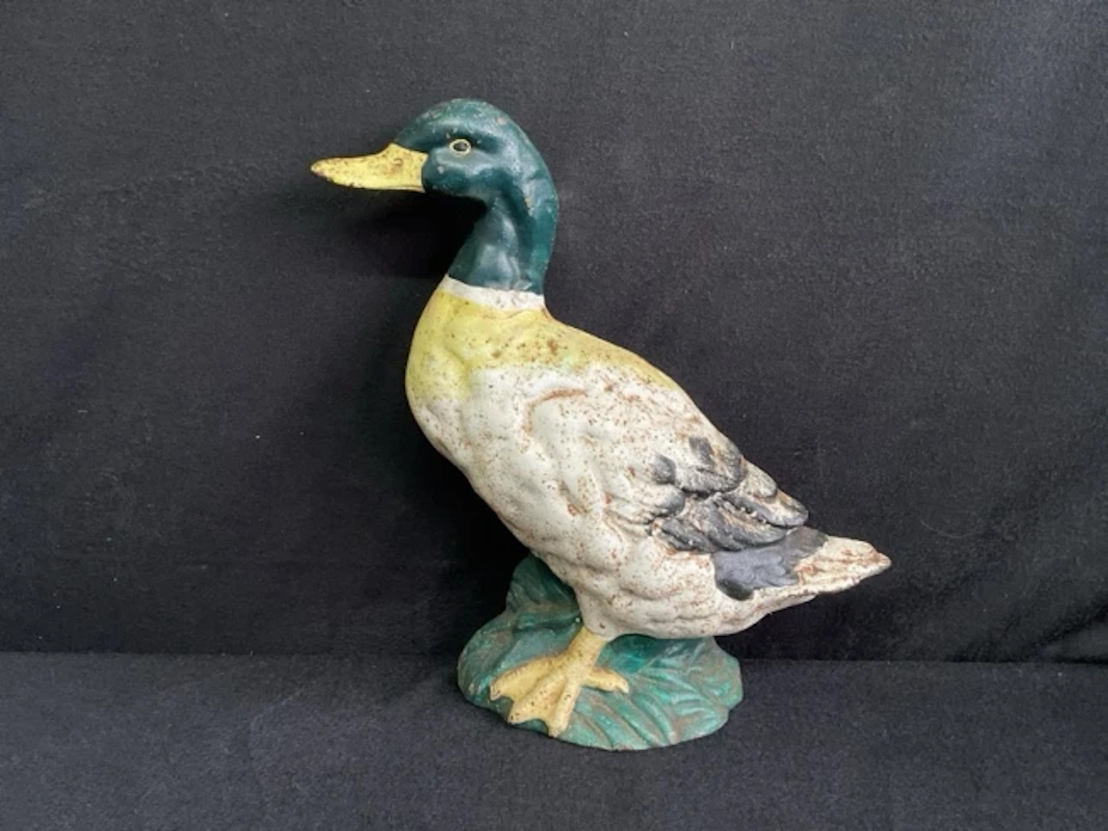 A painted cast iron doorstop modelled as a mallard drake. (12in)