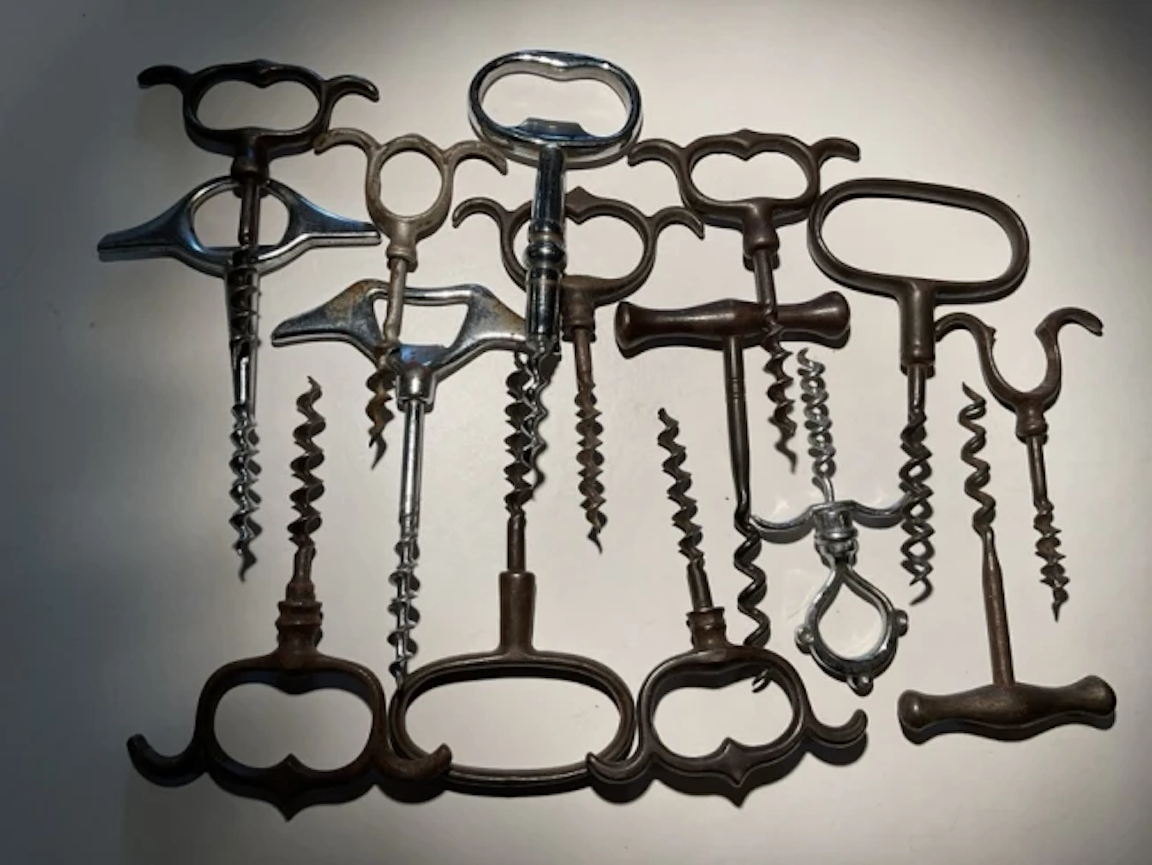 Corkscrew Collection Fifteen iron handled direct pulls - shaped knuckleduster