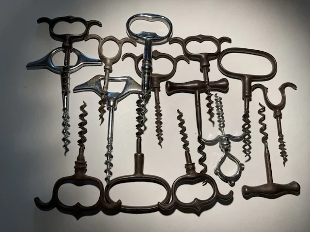 Corkscrew Collection Fifteen iron handled direct pulls - shaped knuckleduster