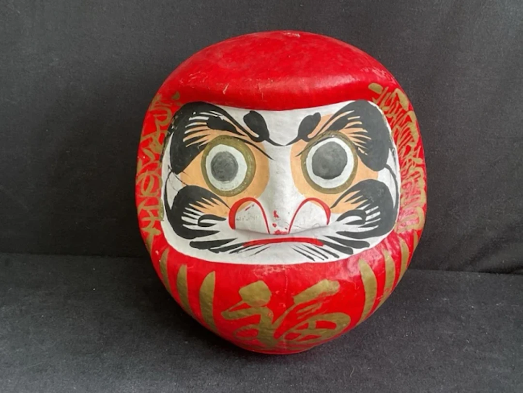 A Japanese handpainted papier-mâché Zen Buddhist good luck Daruma