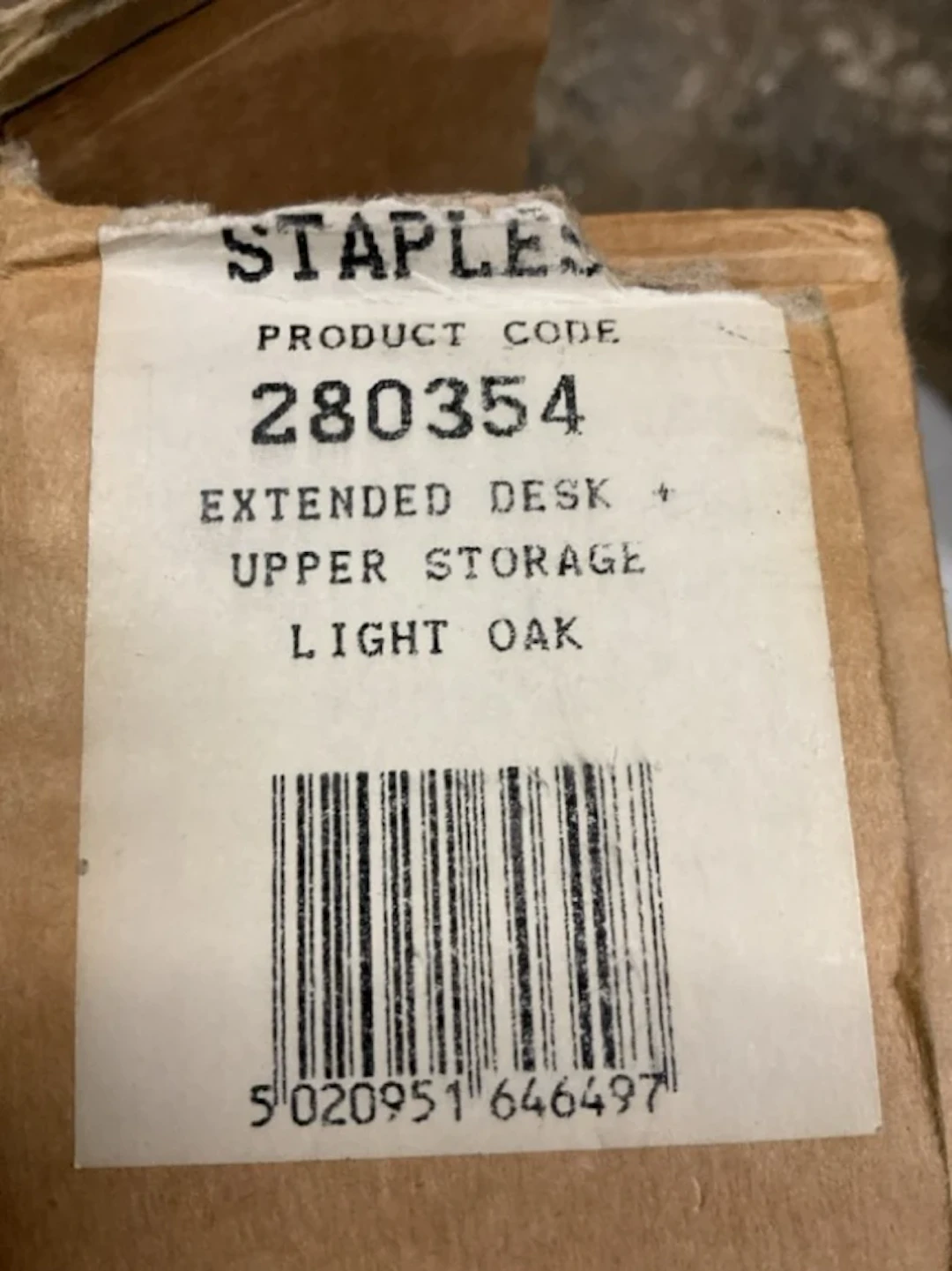 A boxed Staples light oak desk, the storage unit frome the Home Office