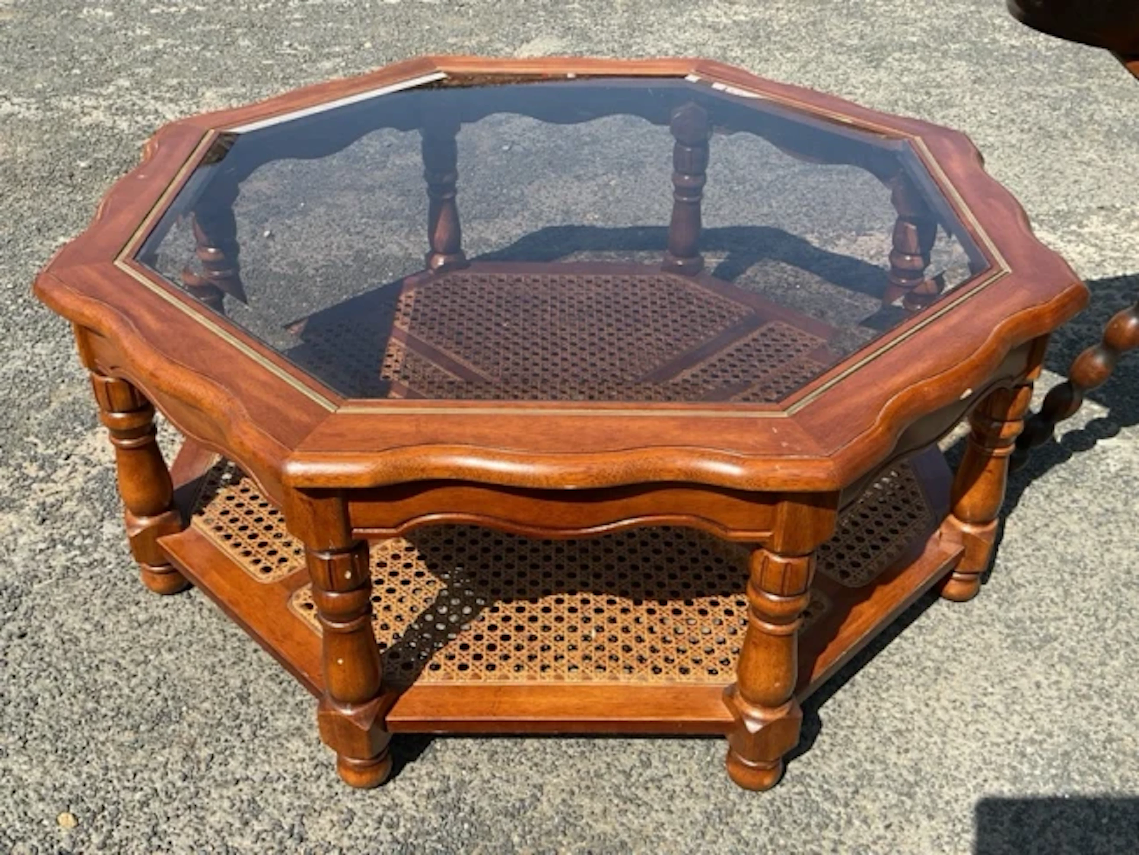 An 80s octagonal coffee table with scalloped moulded top framing a