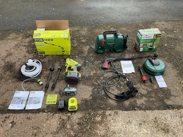 A boxed Ryobi 18V cordless power washer; and a boxed Bosch EasyAquatak
